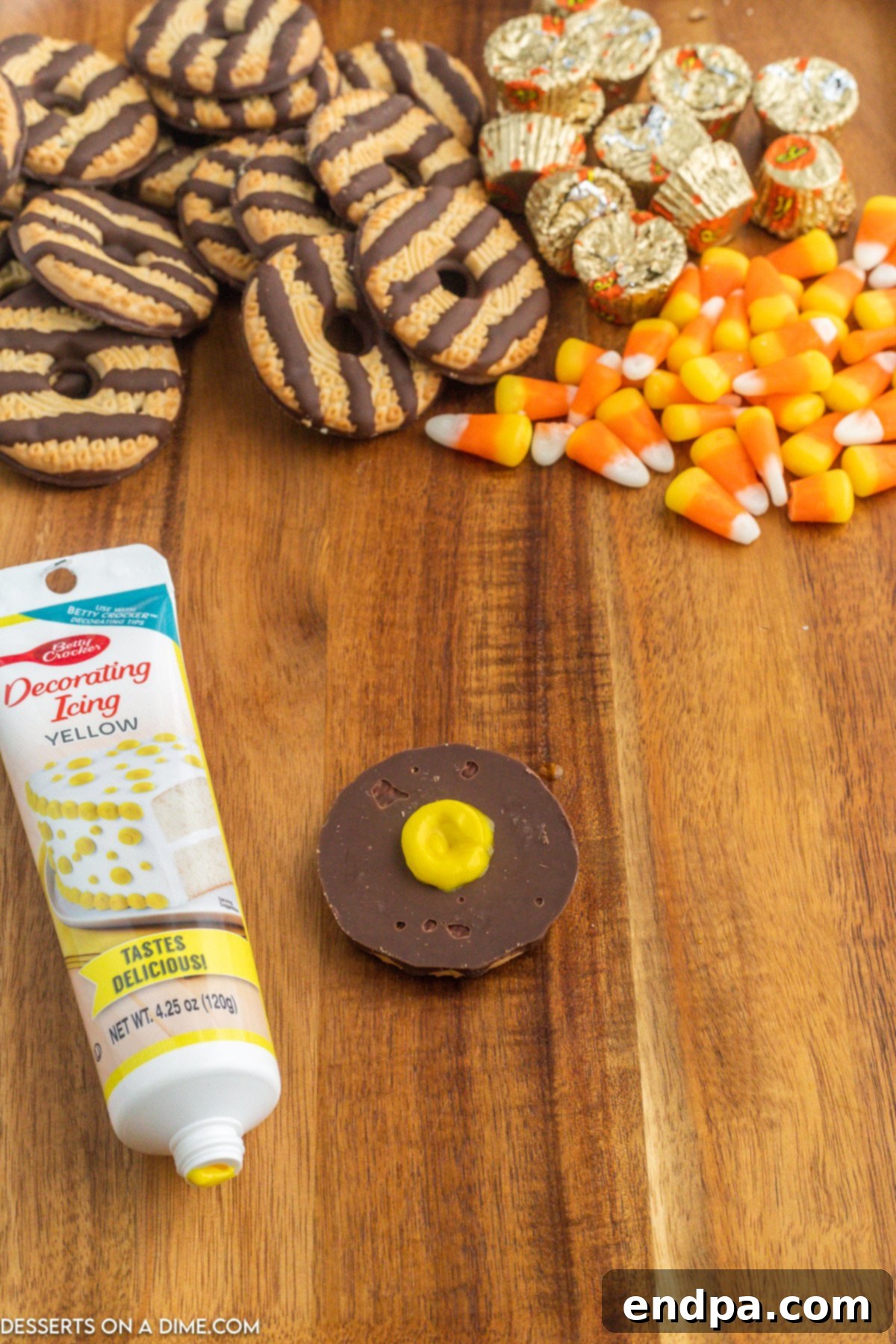 Yellow decorating icing piped in a neat circle on the center of the upside-down cookie.
