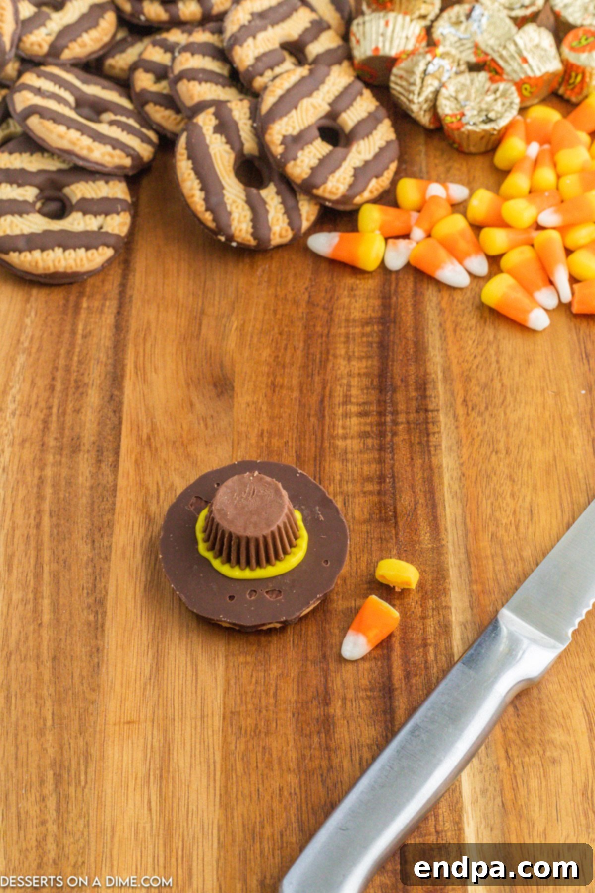 Yellow icing gently seeping out from under the Reese's cup, creating the hat brim effect.