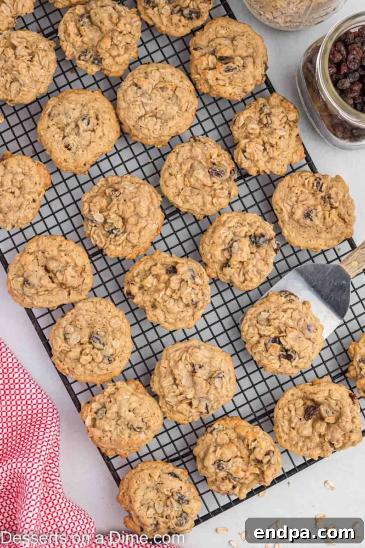 Classic Oatmeal Raisin Cookies 7 Freshly baked oatmeal raisin cookies cooling on a wire rack after being removed from the oven.