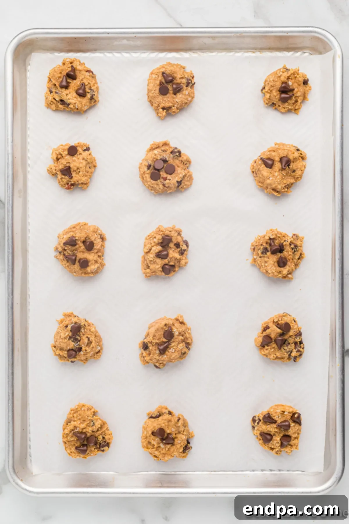 Golden Sweet Potato Cookies 13 Baked sweet potato cookies cooling on the baking sheet, with some moved to a wire rack.