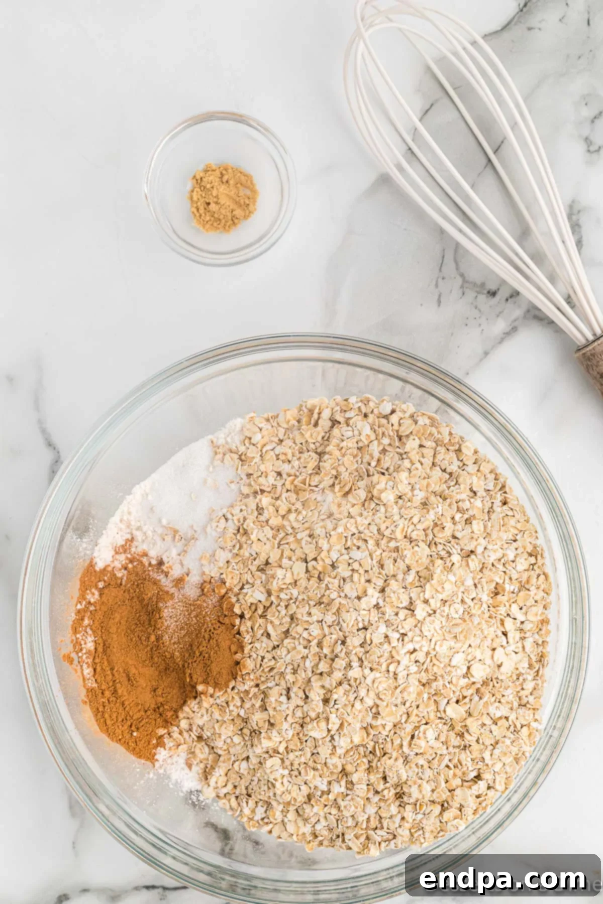 Golden Sweet Potato Cookies 6 Ground ginger being added to the bowl of dry ingredients.