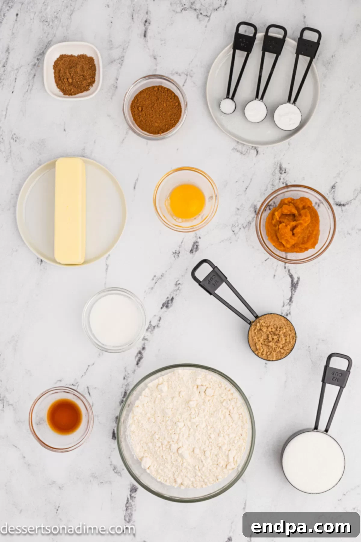 Ingredients for pumpkin snickerdoodles, including butter, sugar, pumpkin puree, egg, vanilla, flour, and pumpkin pie spice.