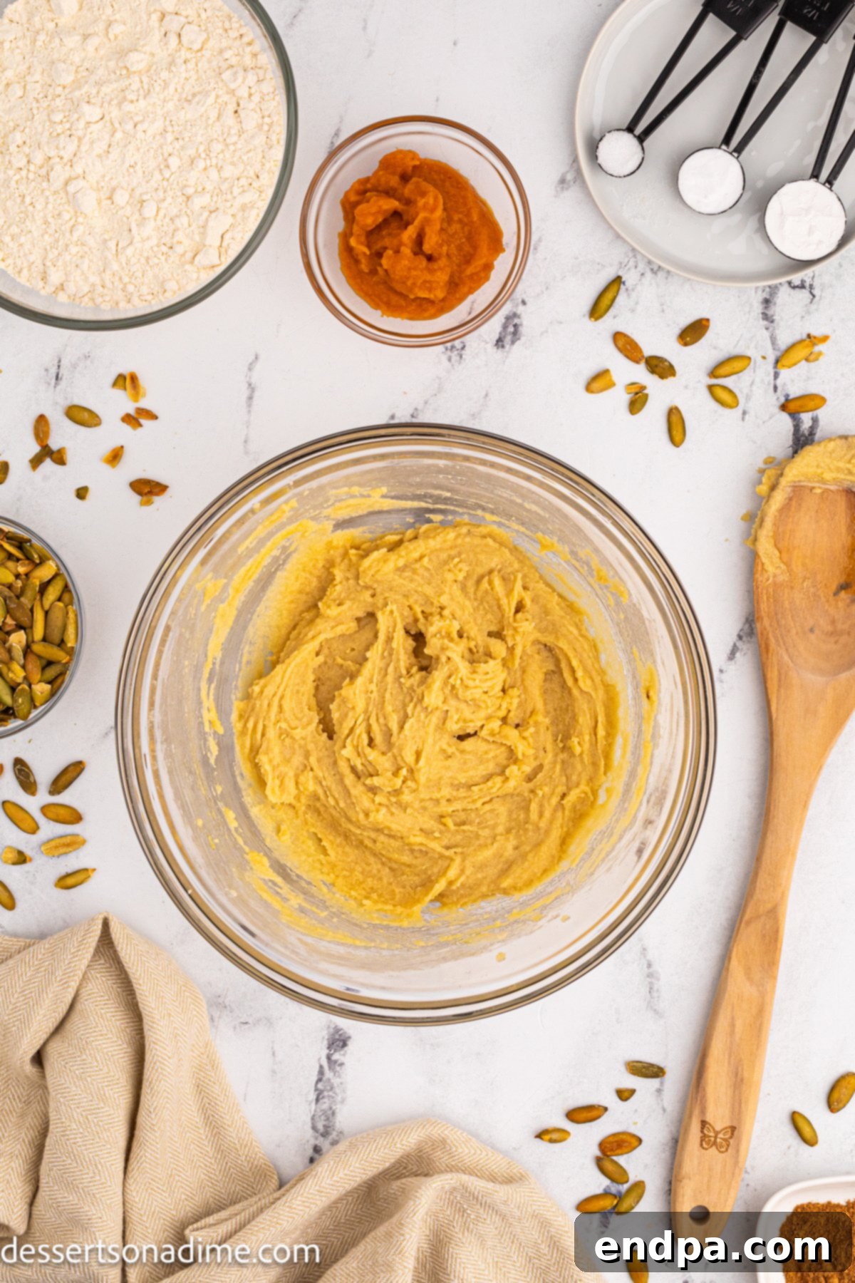 Mixing bowl with butter and sugar being creamed together.