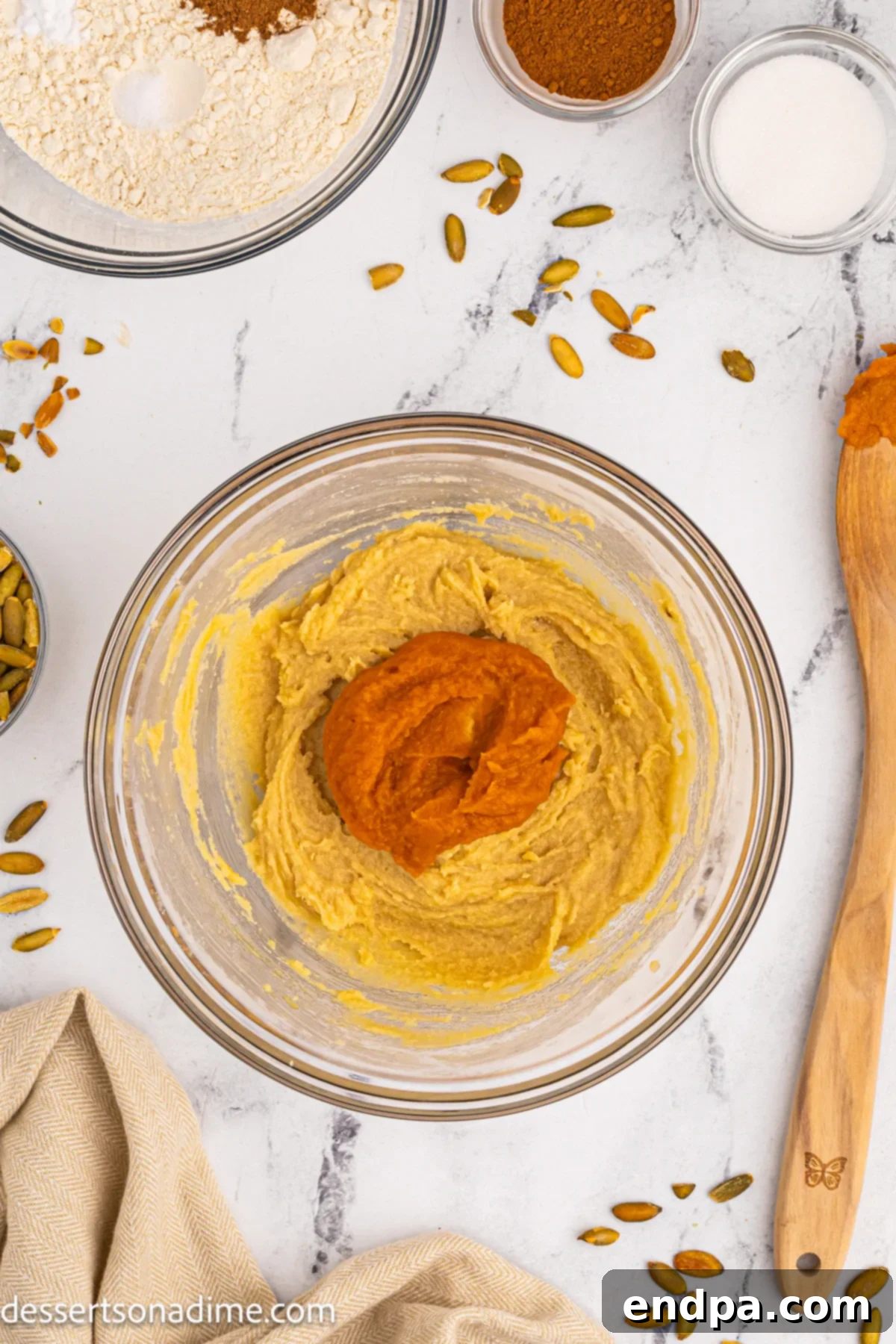 Pumpkin puree mixed into the creamed butter and sugar mixture.