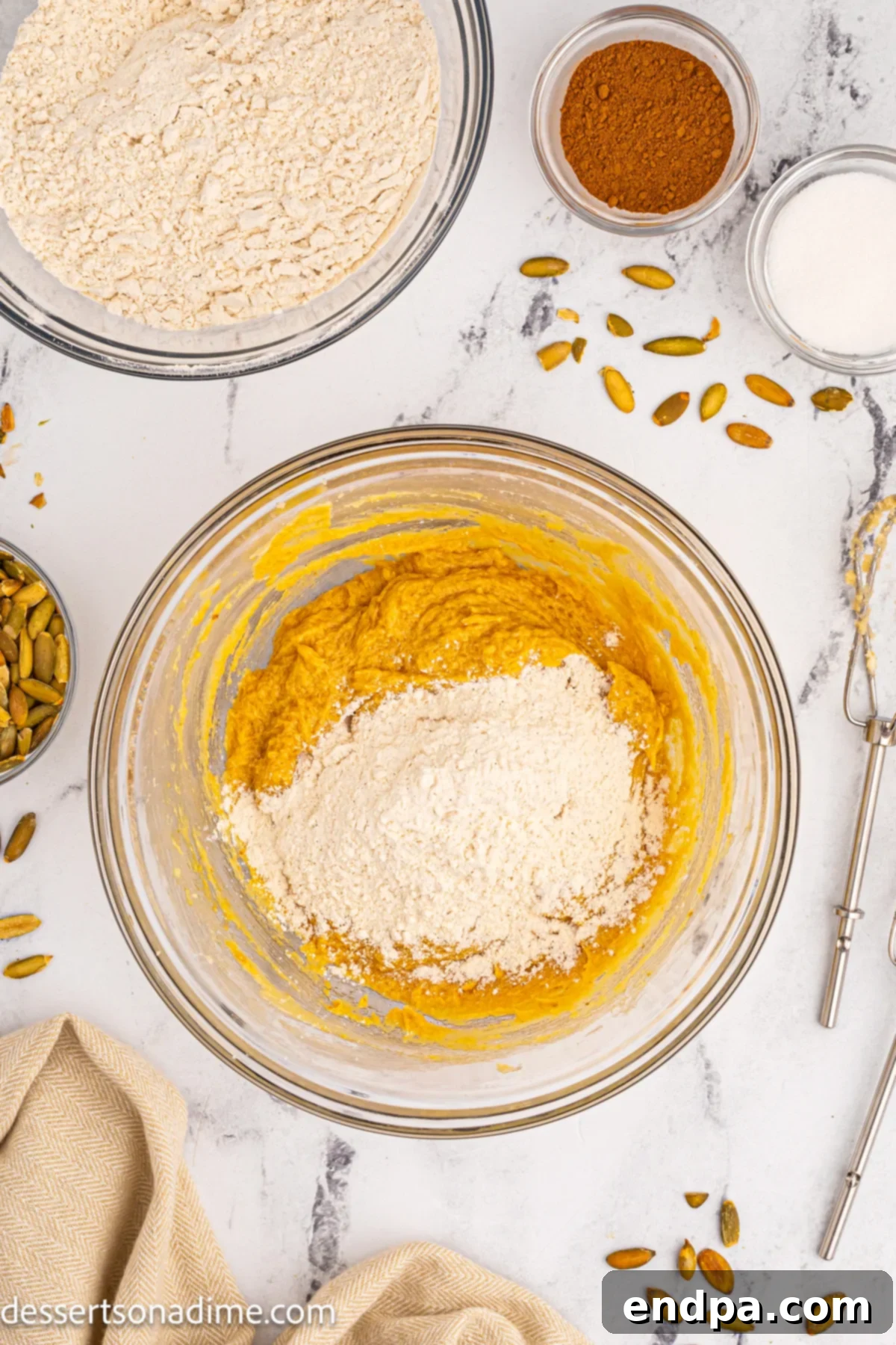 Dry ingredients like flour, baking soda, and spices in a separate bowl.