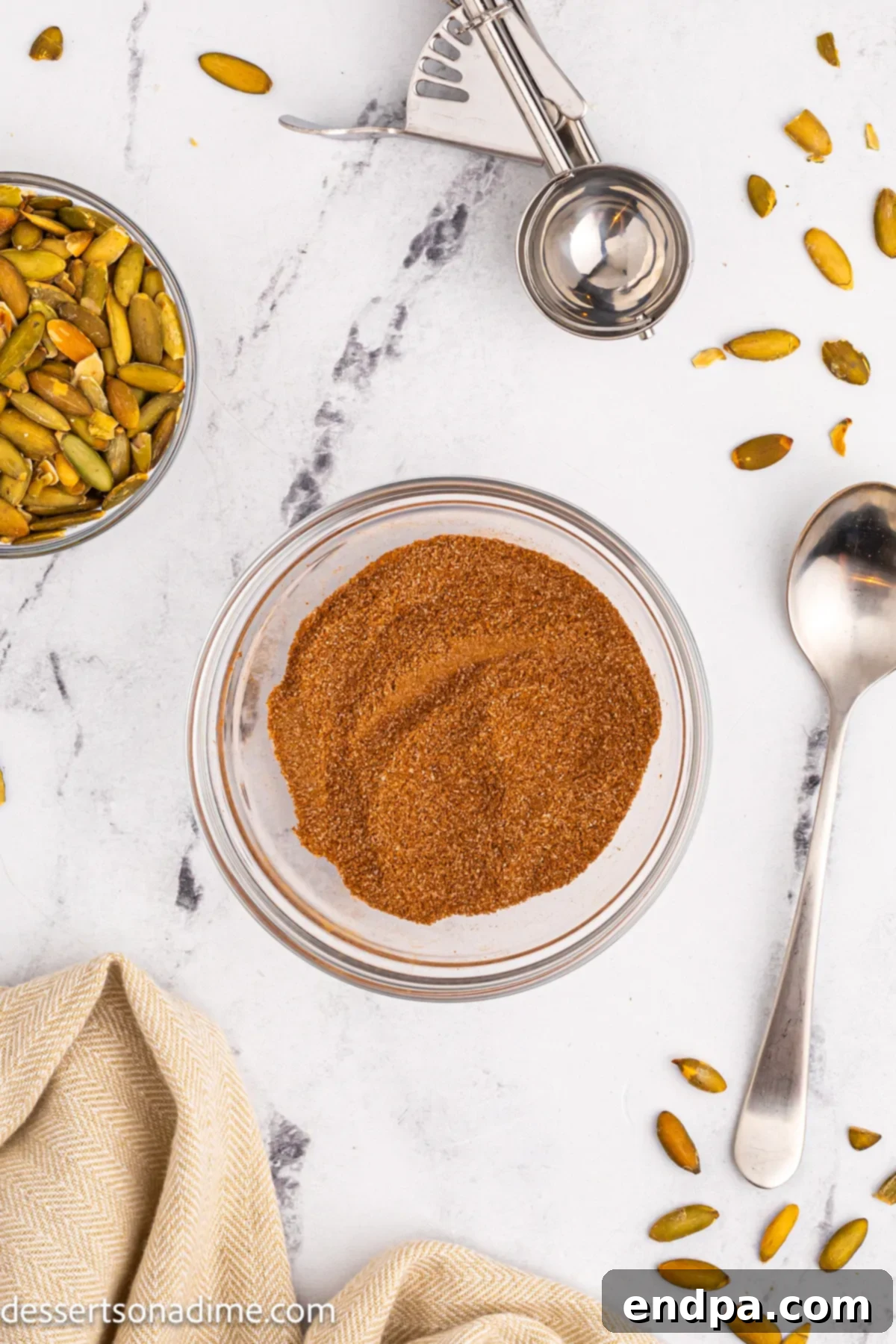 Small bowl containing cinnamon and sugar mixture for coating the cookies.