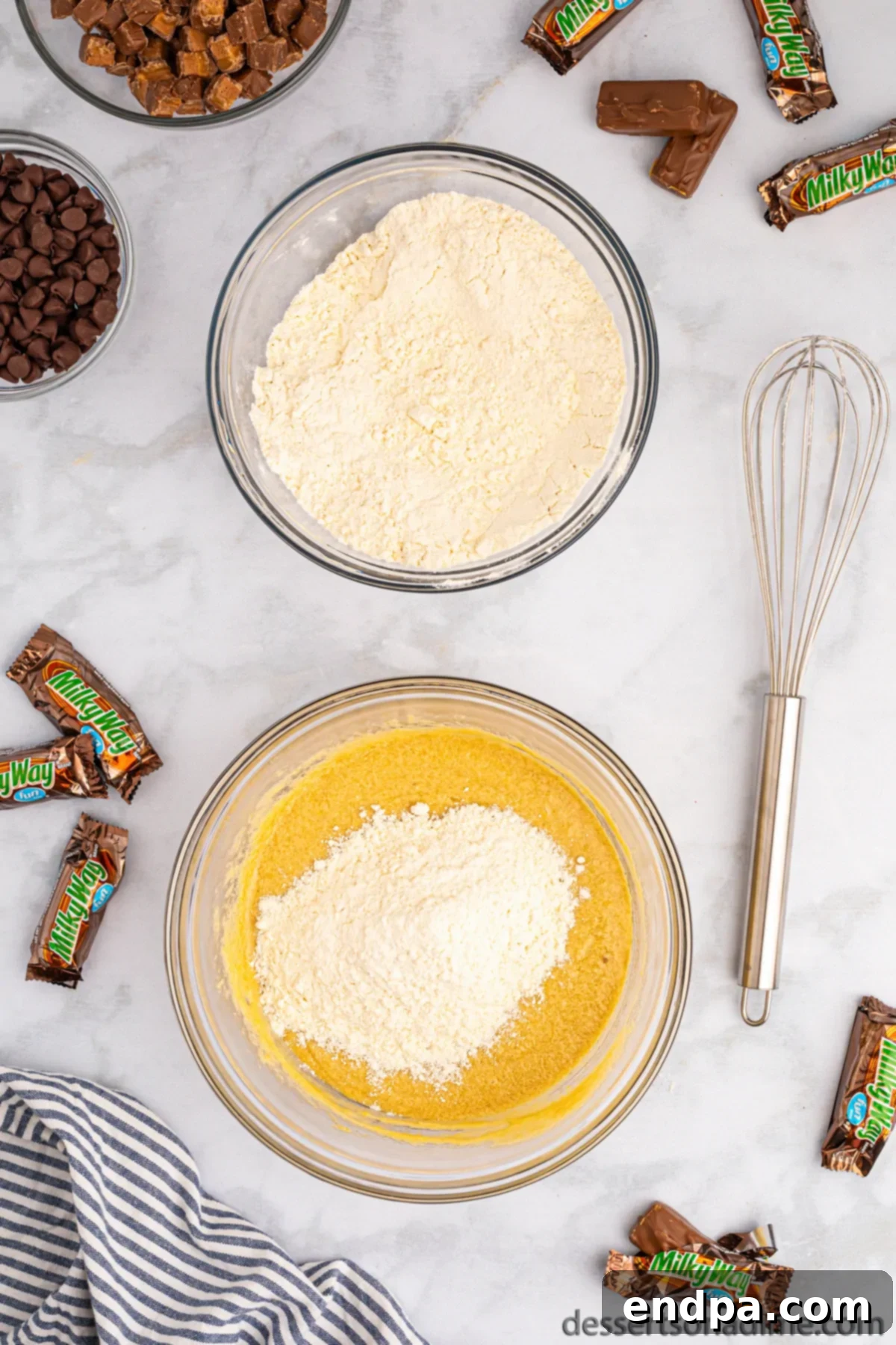 Nougat Caramel Dream Cookies 7 The combined wet and dry ingredients in a mixing bowl, forming a cookie dough.