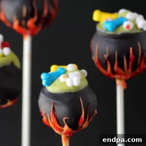 Spooktacular Cake Pops 8 Witches cauldron cake pops, crafted to look like miniature bubbling cauldrons with green 'brew'.