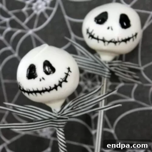 Spooktacular Cake Pops 11 Jack Skellington cake pops featuring his signature black and white face design from the movie.