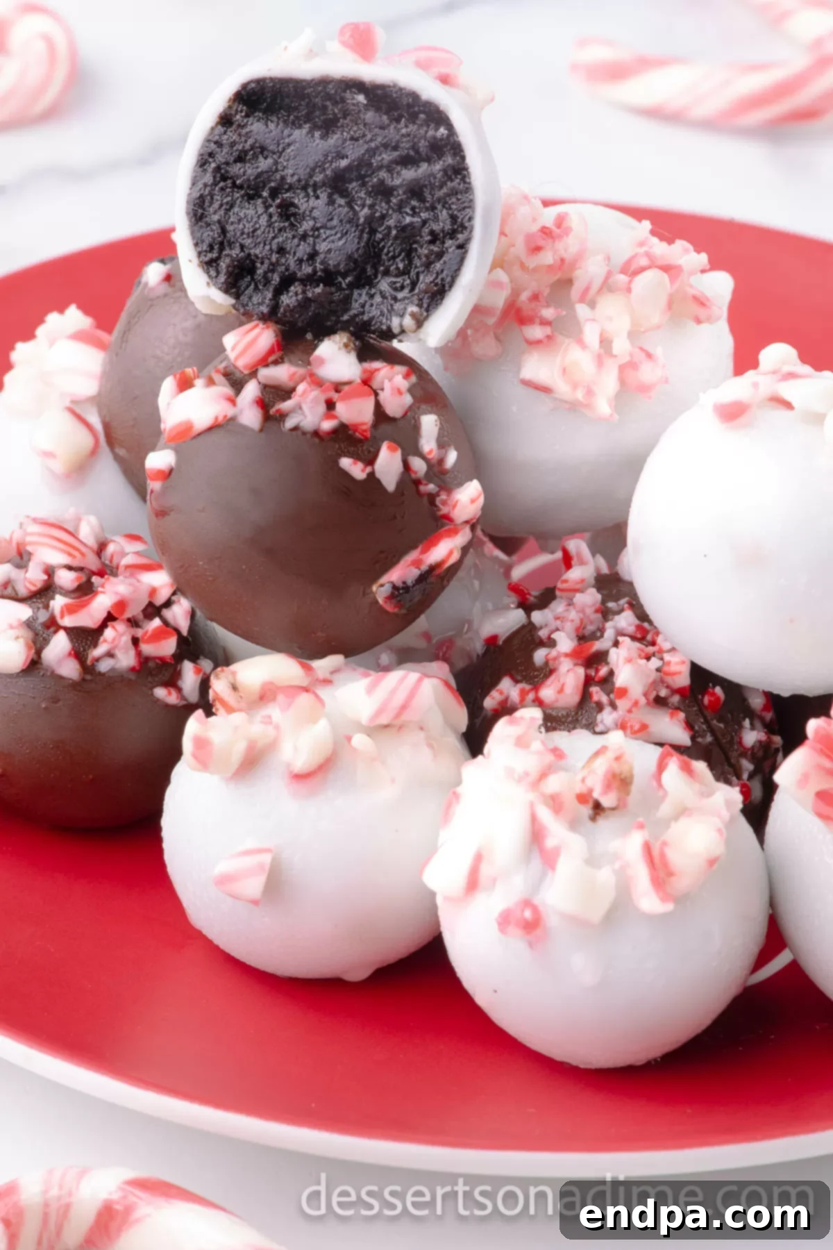 Cool Mint Oreo Truffles 2 Peppermint oreo balls on a platter, ready to be served for holiday guests.