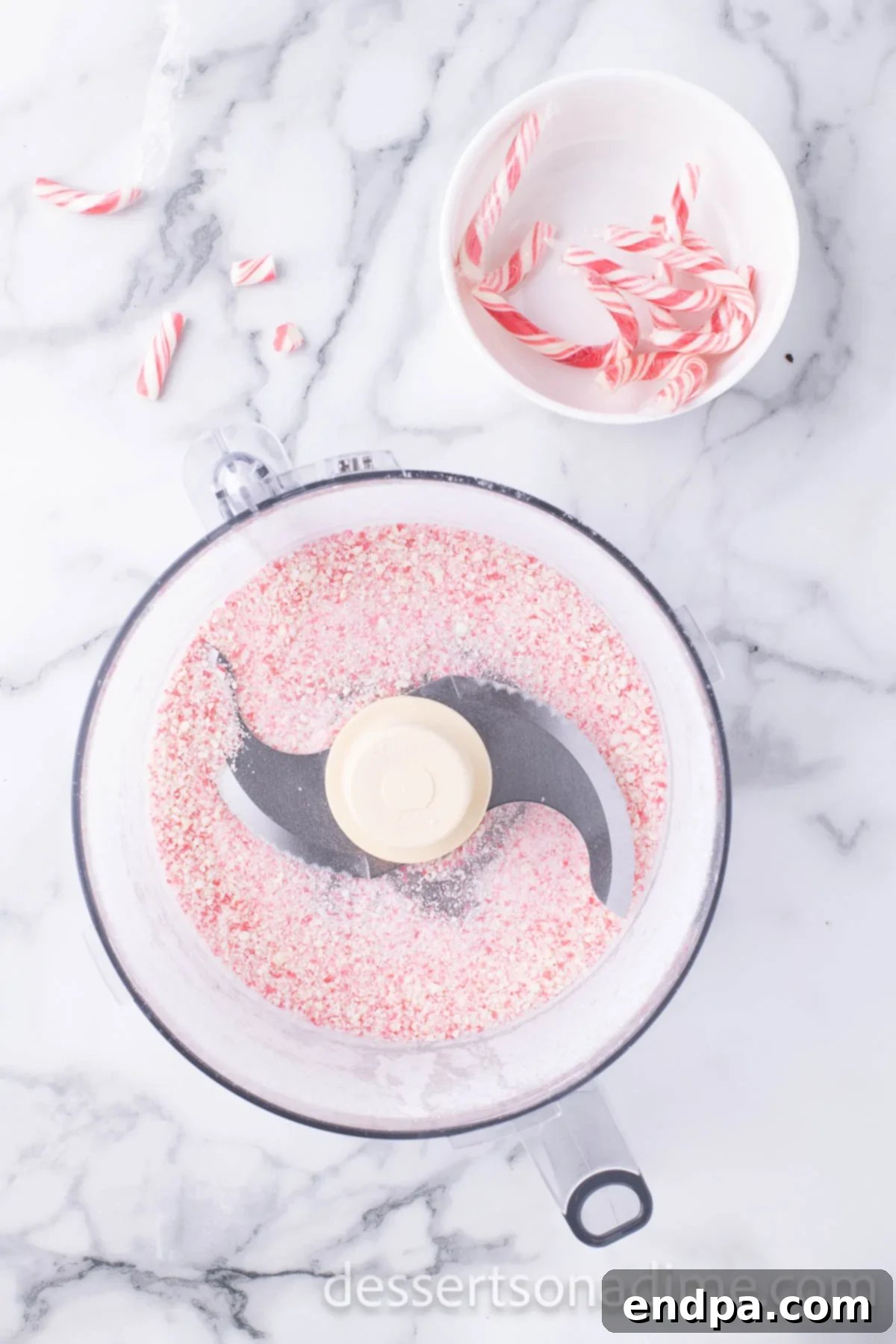 Cool Mint Oreo Truffles 4 Candy canes in a food processor, ready to be finely crushed.