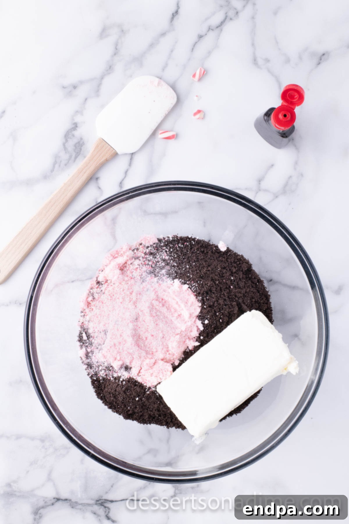 Cool Mint Oreo Truffles 6 Softened cream cheese, peppermint extract, and crushed Oreo crumbs in a mixing bowl.
