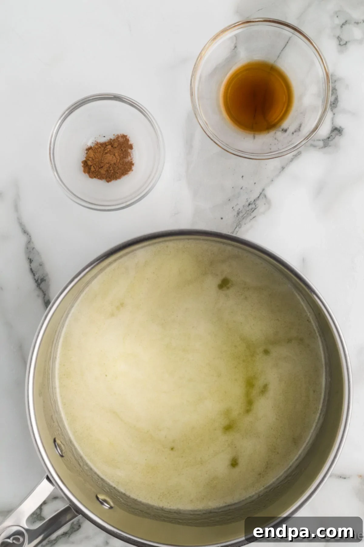Autumn Pumpkin Spice Delights 4 Saucepan with melted butter, sugar and milk ready for mixing.