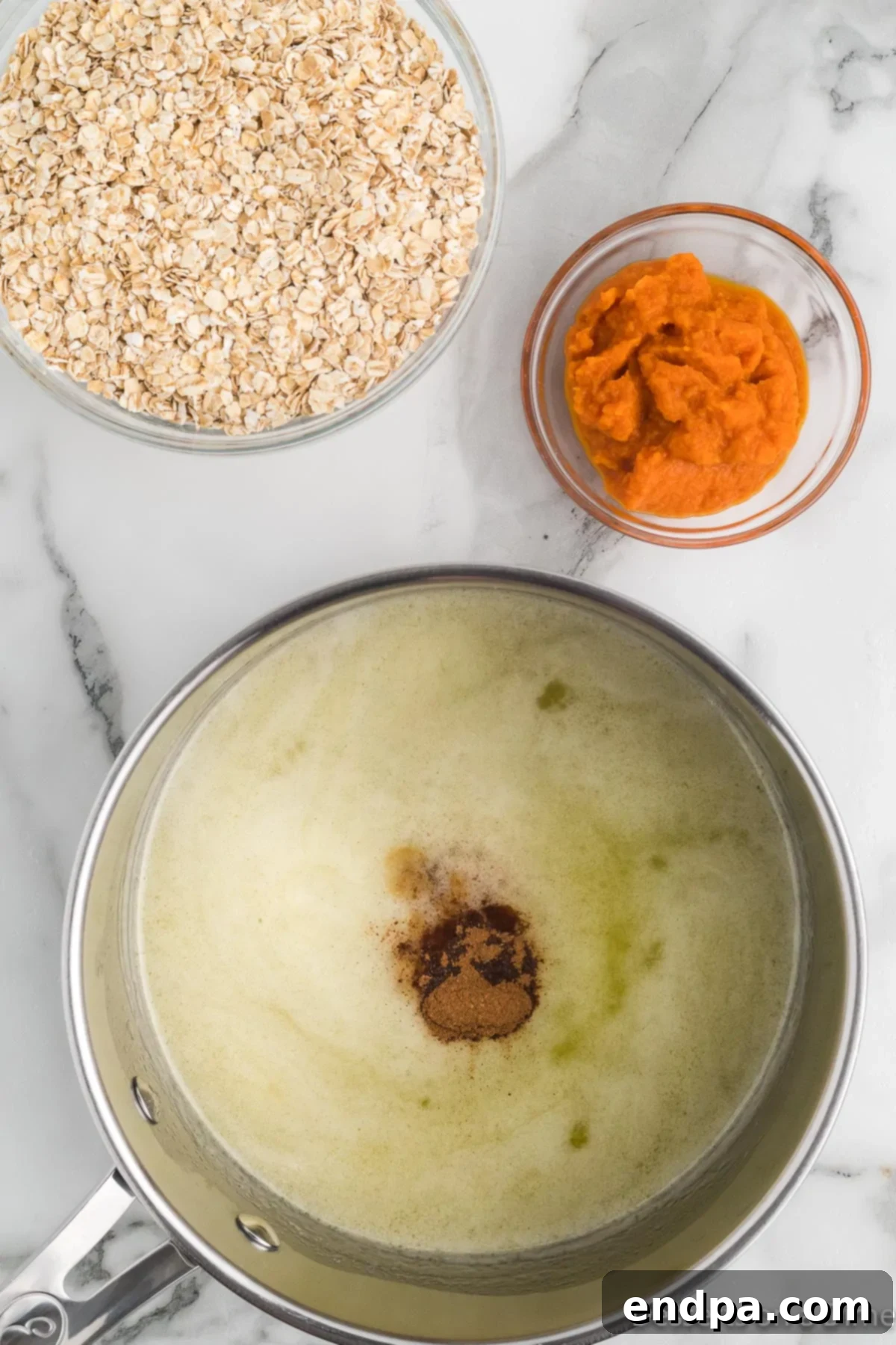 Autumn Pumpkin Spice Delights 5 Pumpkin pie spice and pumpkin puree being added to the saucepan mixture.
