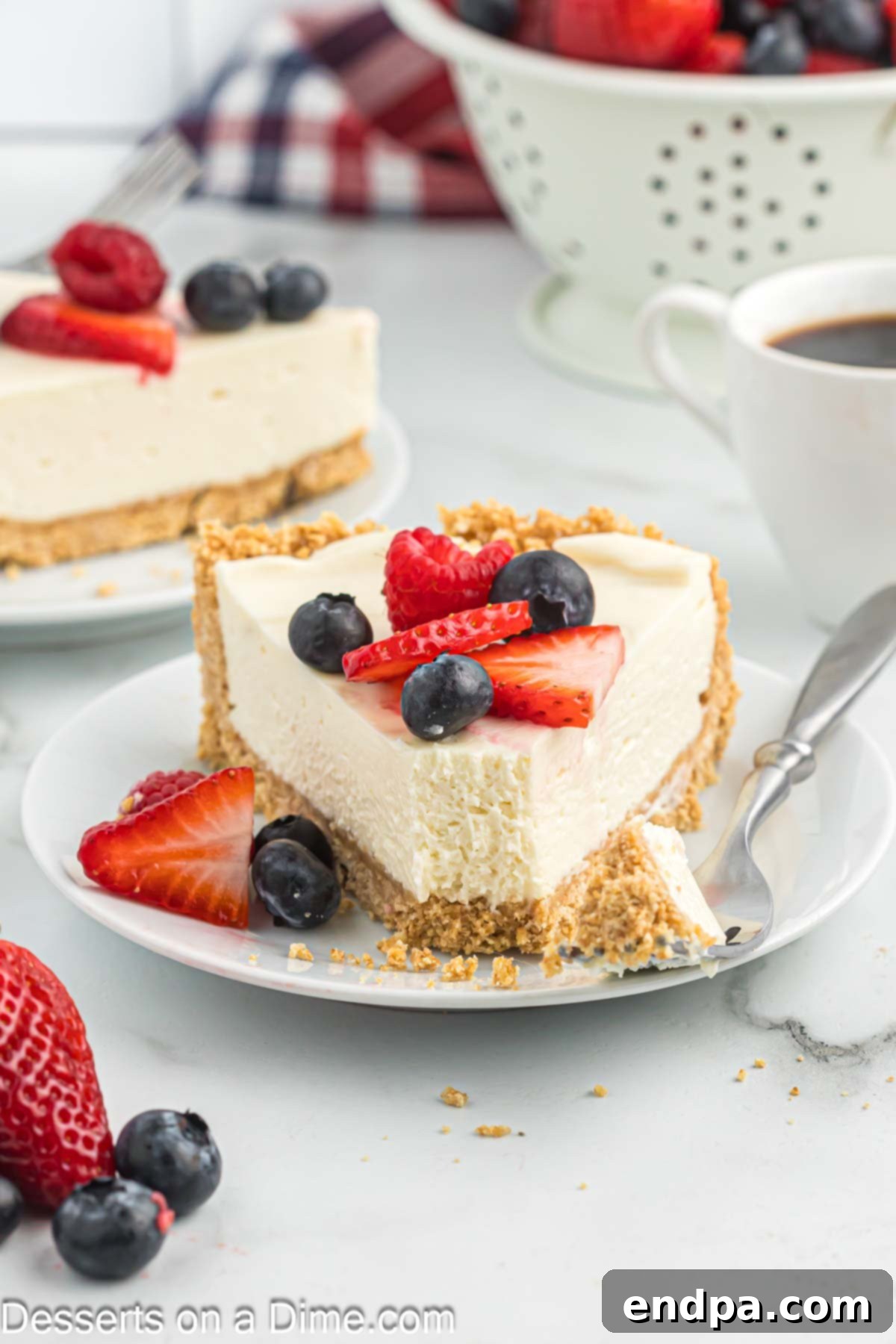 Simple No-Bake Cheesecake Dream 11 Slice of cheesecake on plate.