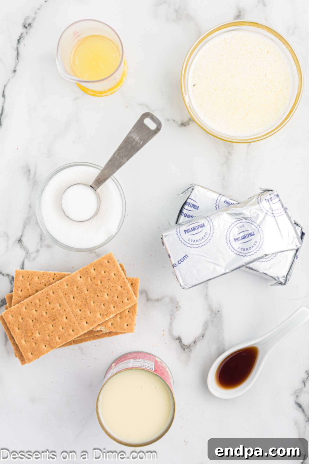 Simple No-Bake Cheesecake Dream 3 Ingredients for cheesecake - graham crackers, cream cheese, sweetened condensed milk, lemon juice whipped cream.