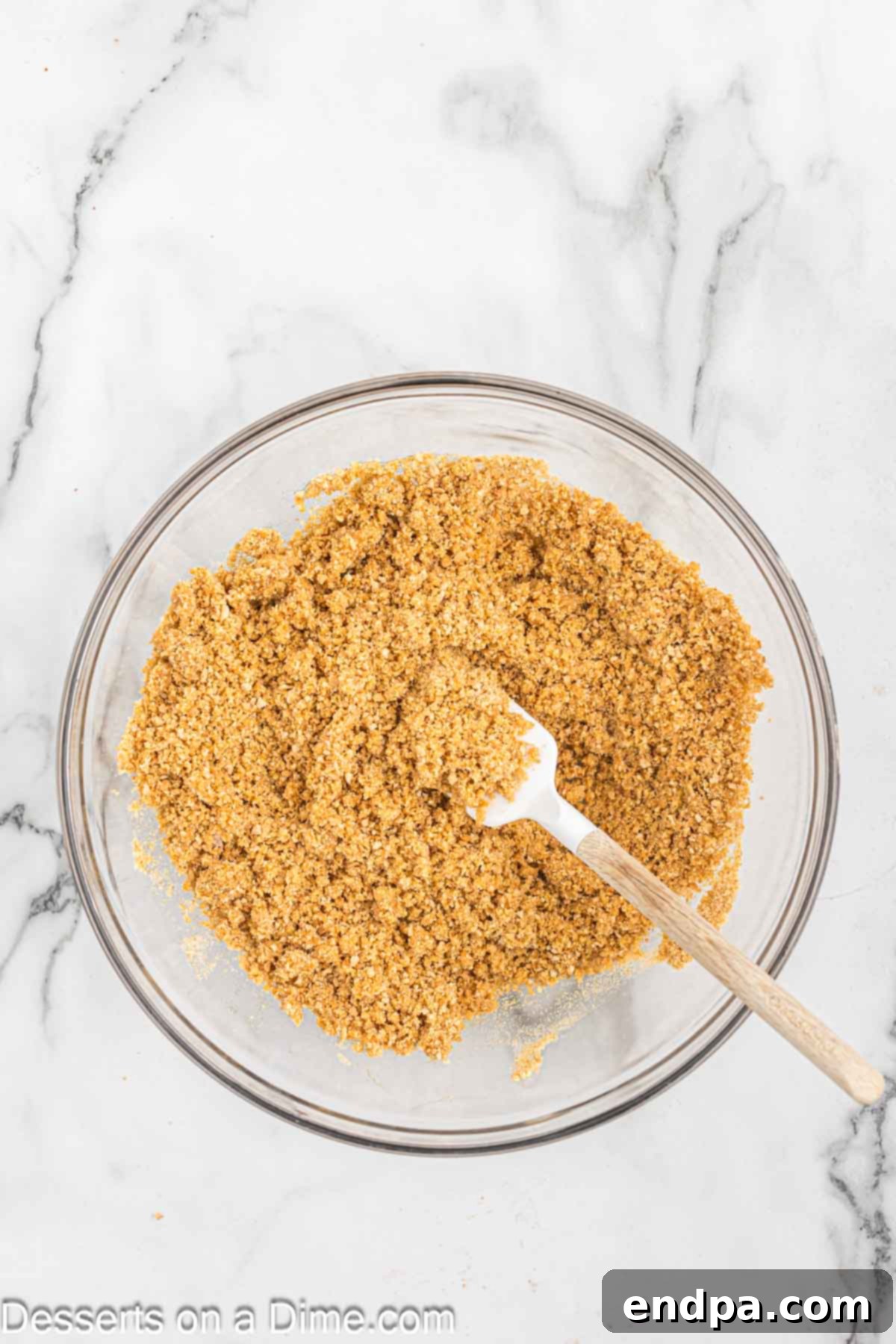 Simple No-Bake Cheesecake Dream 5 Butter added to graham cracker crumbs.