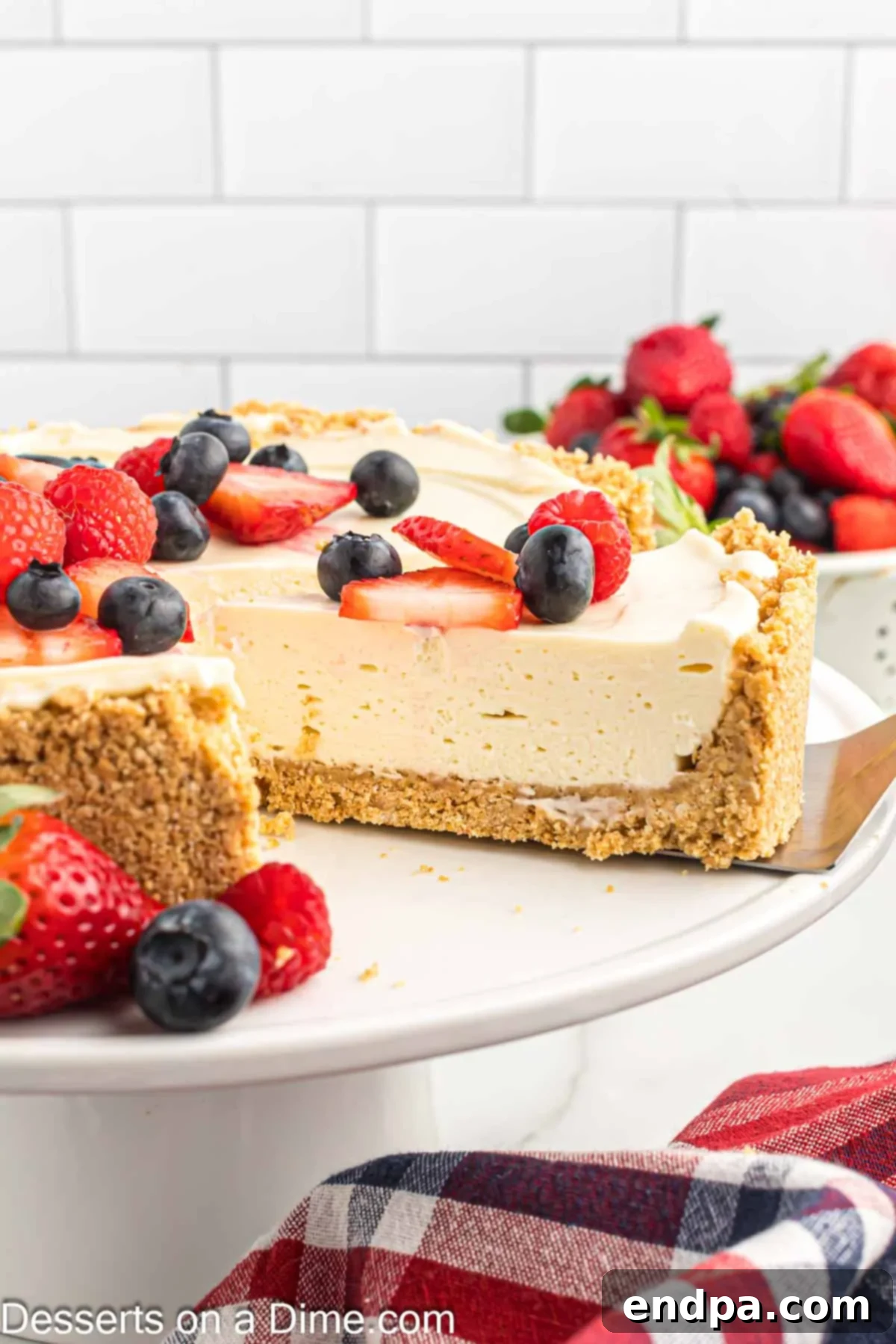 Simple No-Bake Cheesecake Dream 10 Cheesecake being sliced.