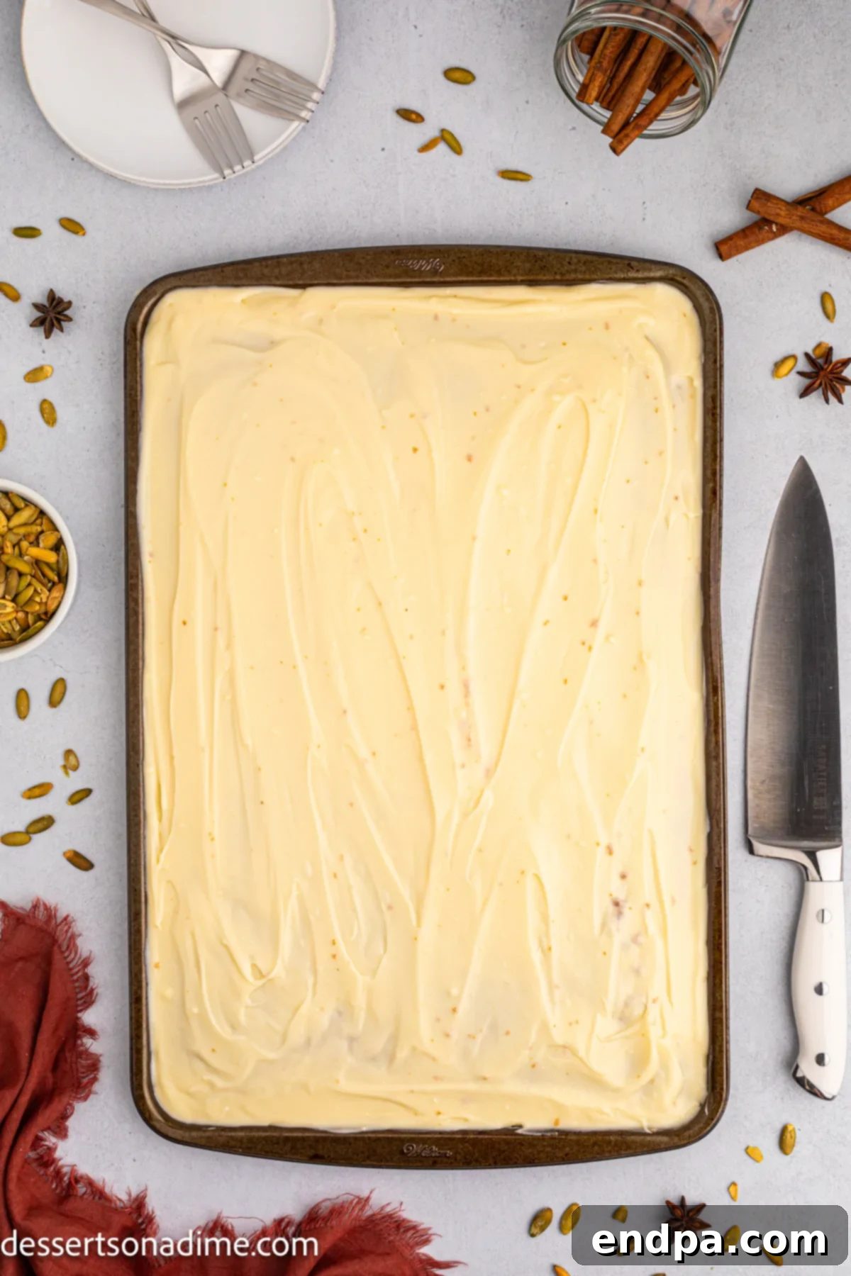 Frosting spread on cake.