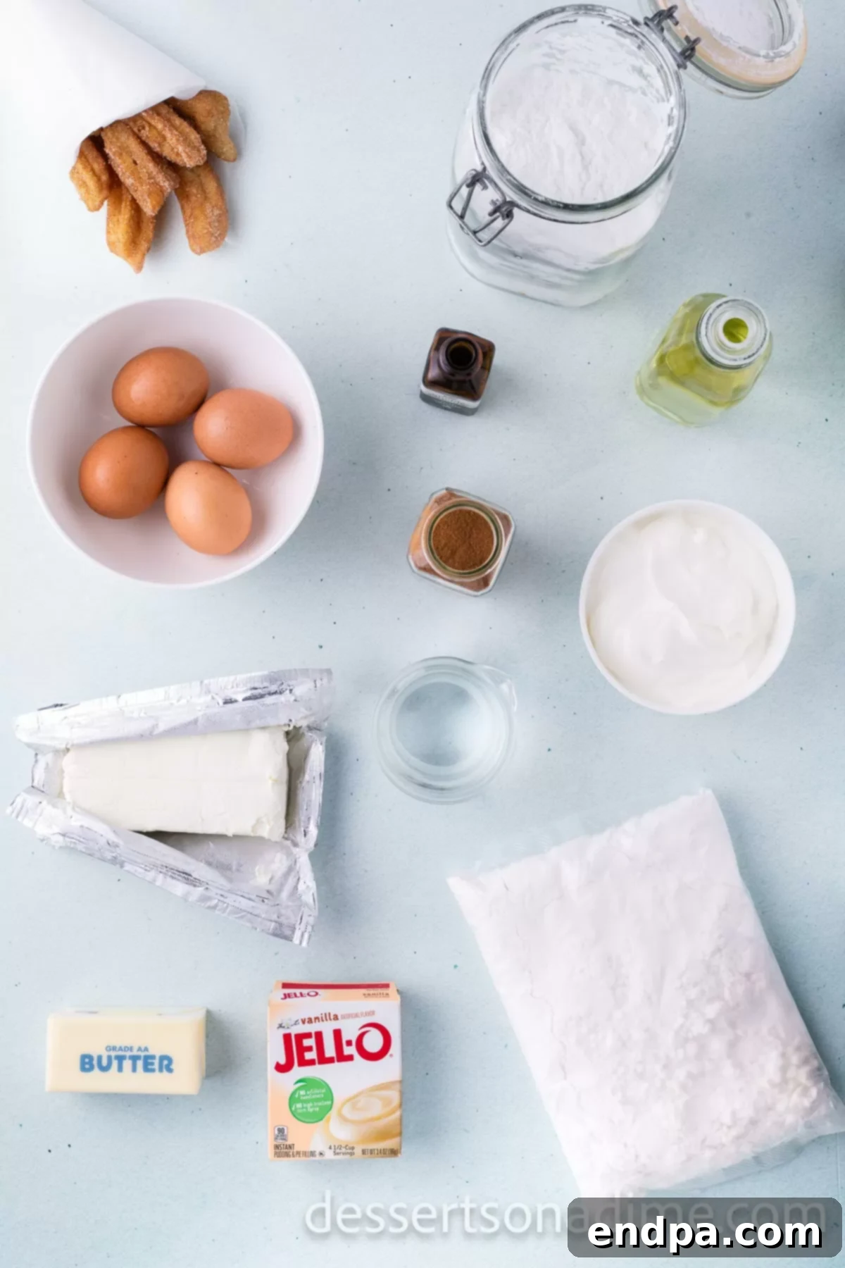 Cinnamon Sugar Swirl Cupcakes 3 Ingredients for Churro Cupcakes - white cake mix, vanilla pudding, cinnamon, eggs, sour cream, cream cheese, powdered sugar, vanilla, churros.