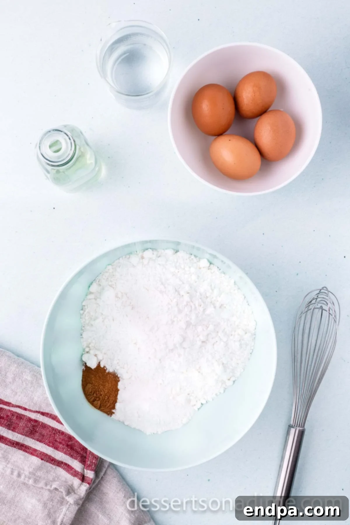 Cinnamon Sugar Swirl Cupcakes 4 Mixing together cake mix, pudding mix, and ground cinnamon in a bowl