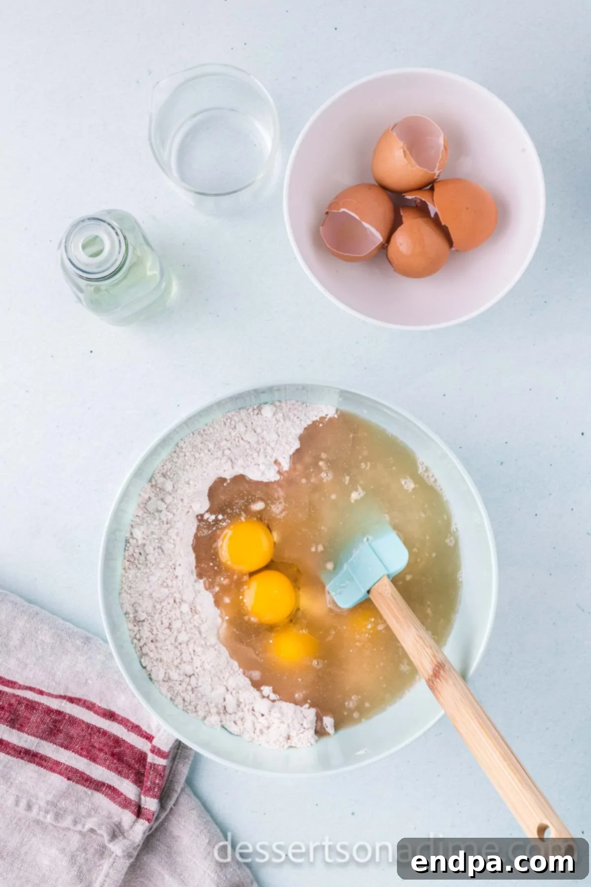 Cinnamon Sugar Swirl Cupcakes 5 Stirring in eggs, oil, and water into the dry ingredients