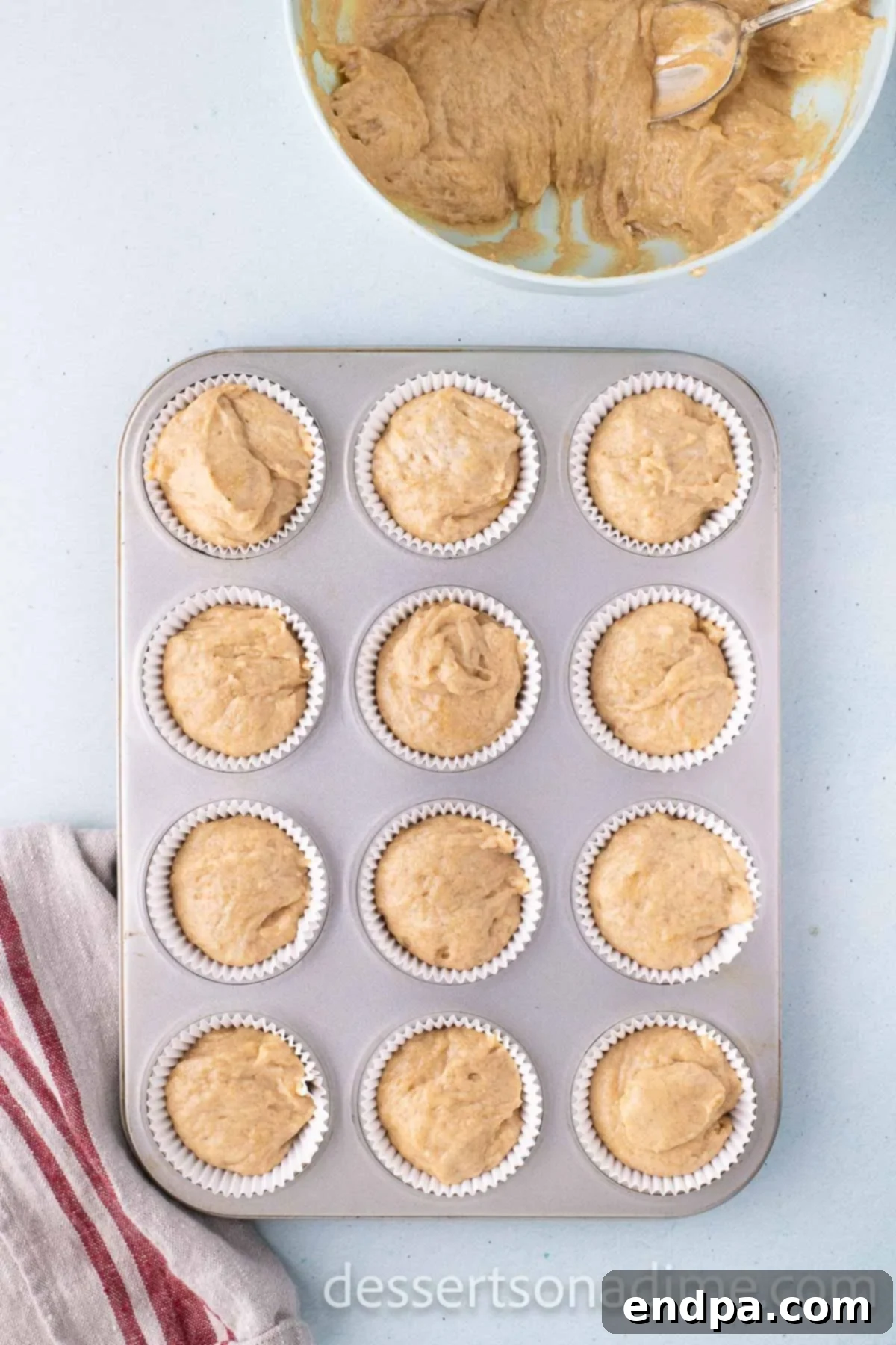 Cinnamon Sugar Swirl Cupcakes 7 Placing the cupcake batter into the cupcake liners