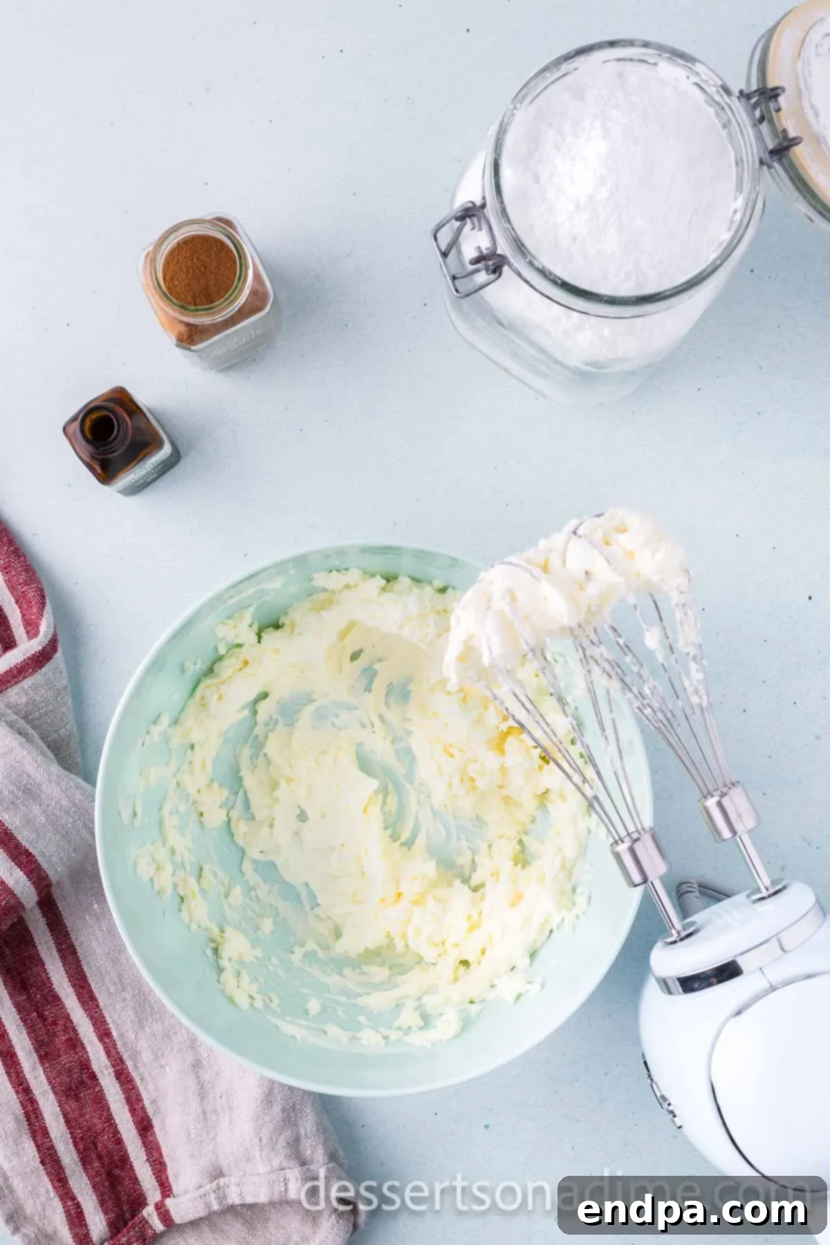 Cinnamon Sugar Swirl Cupcakes 8 Beating together cream cheese and butter into a bowl