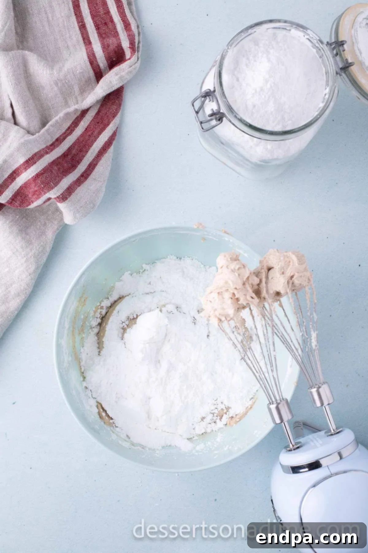 Cinnamon Sugar Swirl Cupcakes 9 Adding in powdered sugar