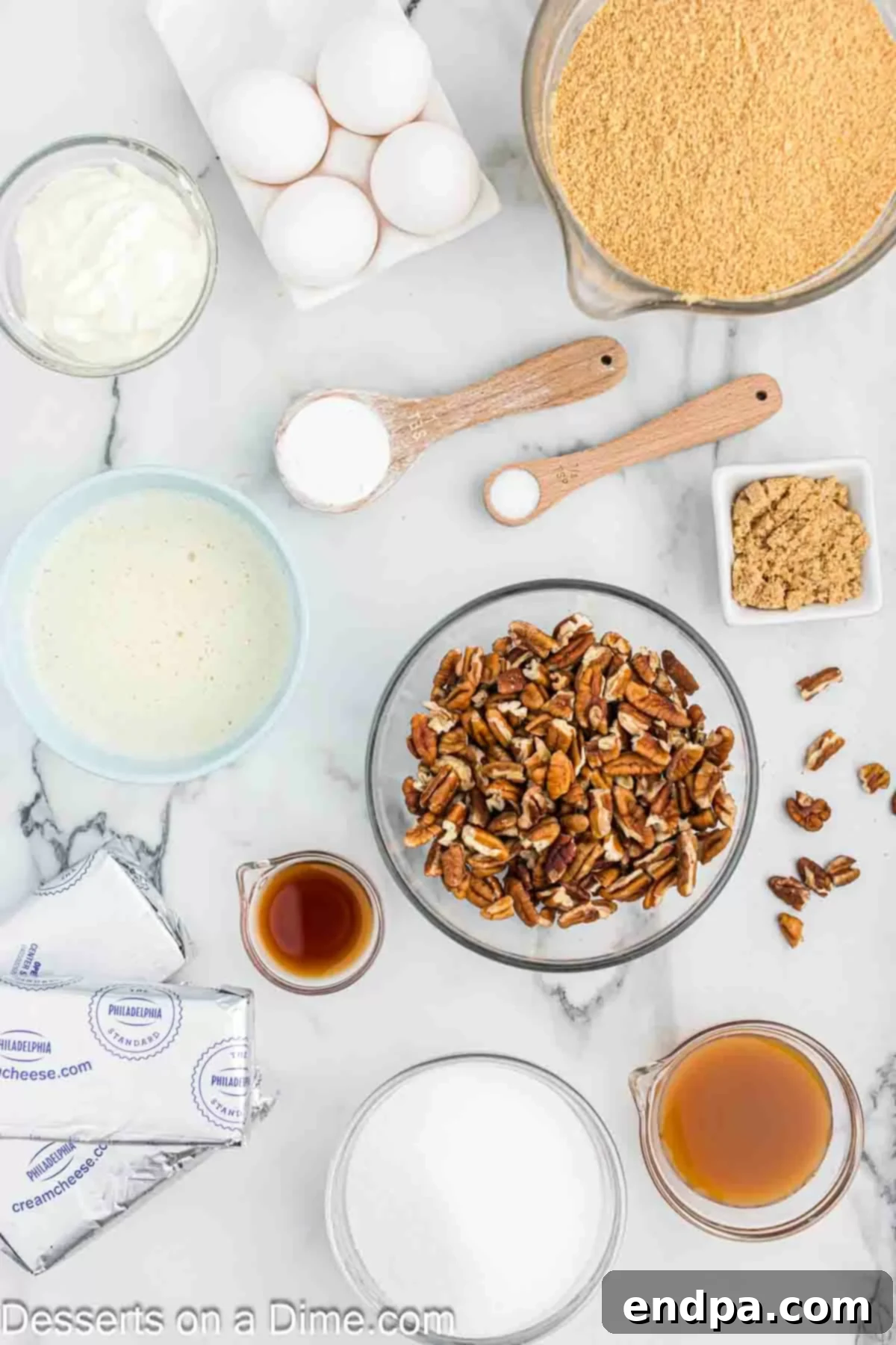 Golden Butter Pecan Cheesecake 3 A vibrant flat lay image displaying all the essential ingredients for a delicious butter pecan cheesecake: fresh pecans, creamy butter, rich brown sugar, crisp graham crackers, granulated sugar, softened cream cheese, fragrant vanilla extract, cornstarch, decadent caramel sauce, and fluffy whipped cream.