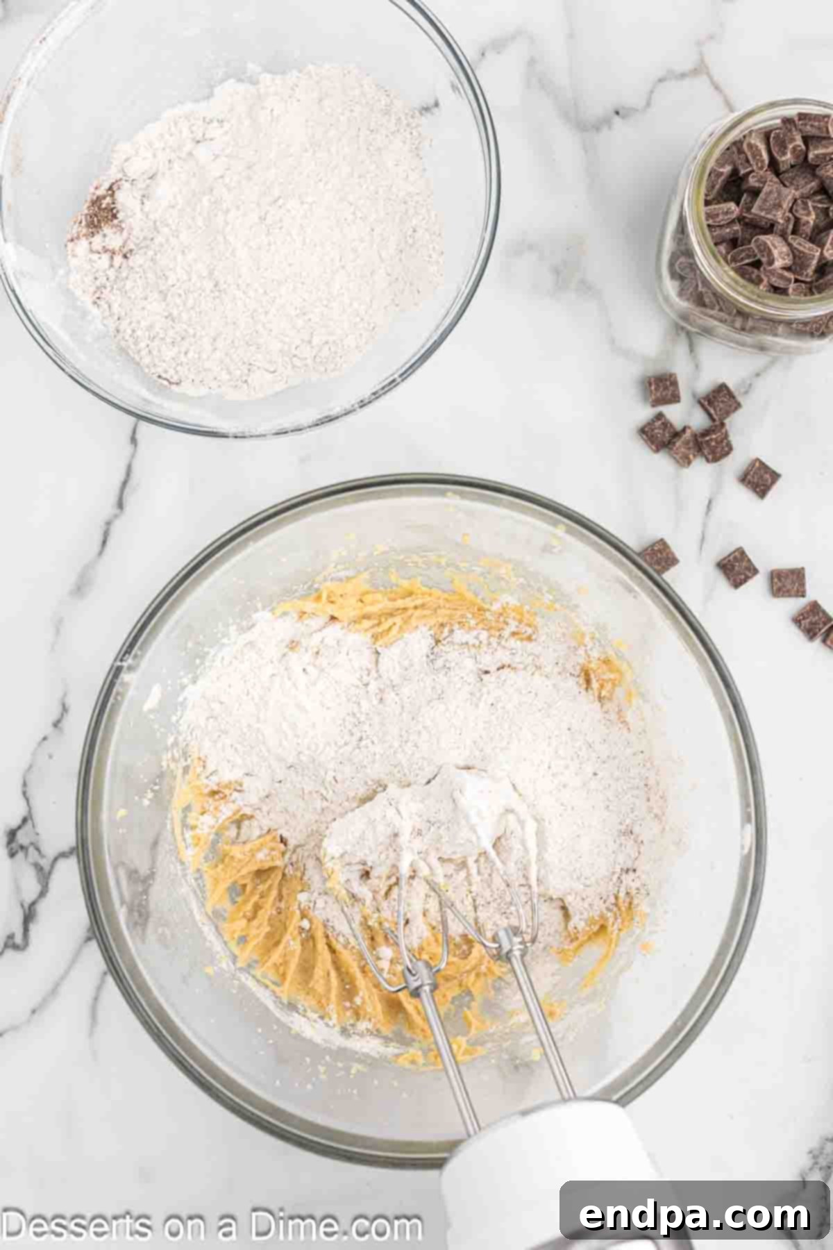 Espresso Delights 6 Dry ingredients (flour, instant coffee, baking soda, salt) being gently folded into the wet batter.