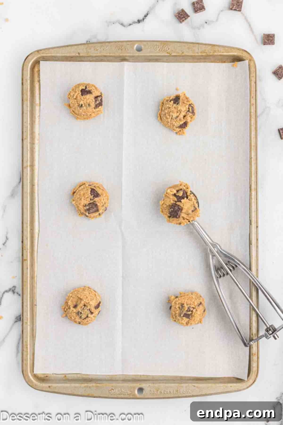 Espresso Delights 8 Scoops of coffee cookie dough neatly arranged on a baking sheet, ready for the oven.