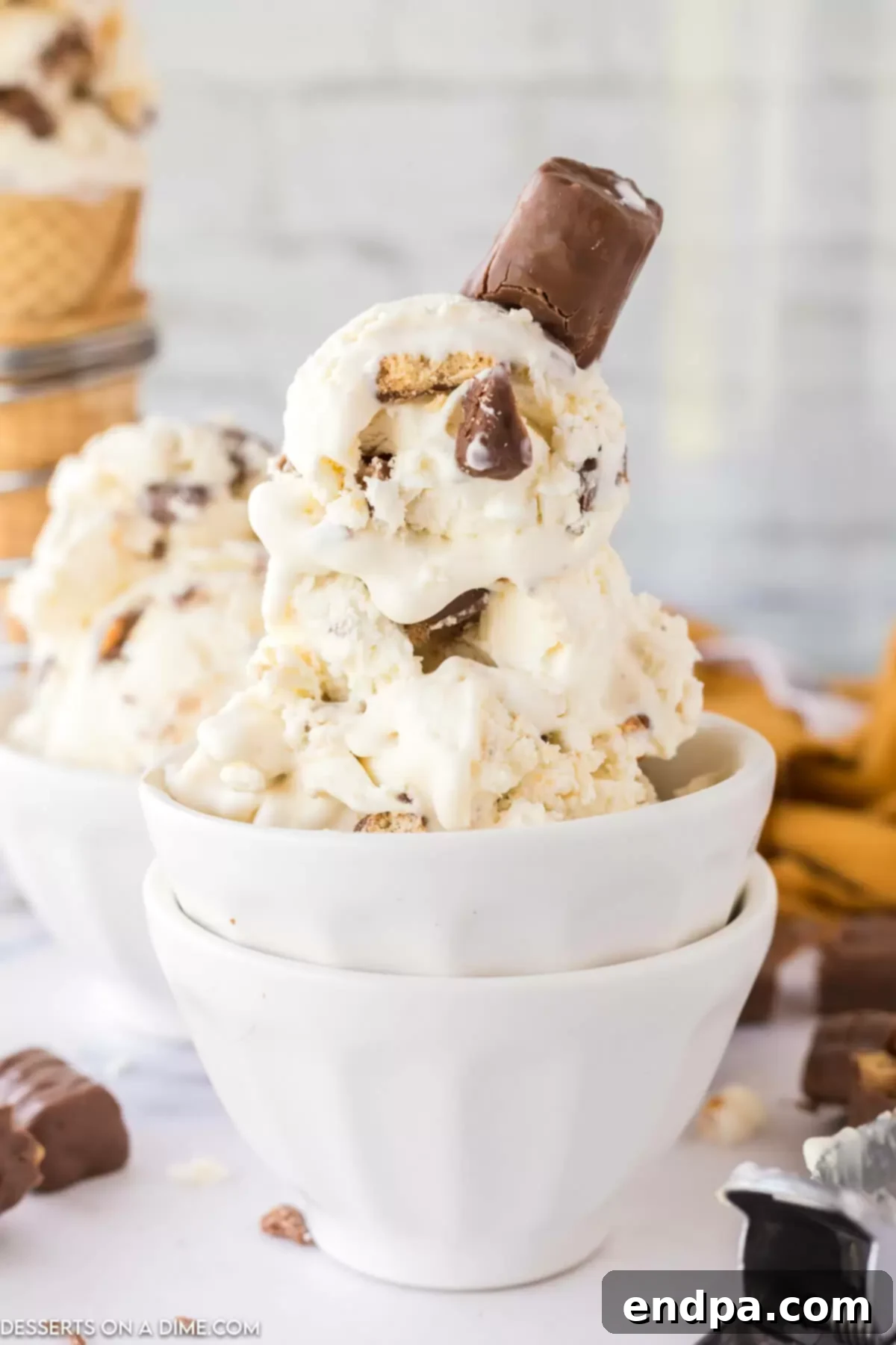 Close-up shot of a bowl of Twix Ice Cream, ready to be enjoyed.