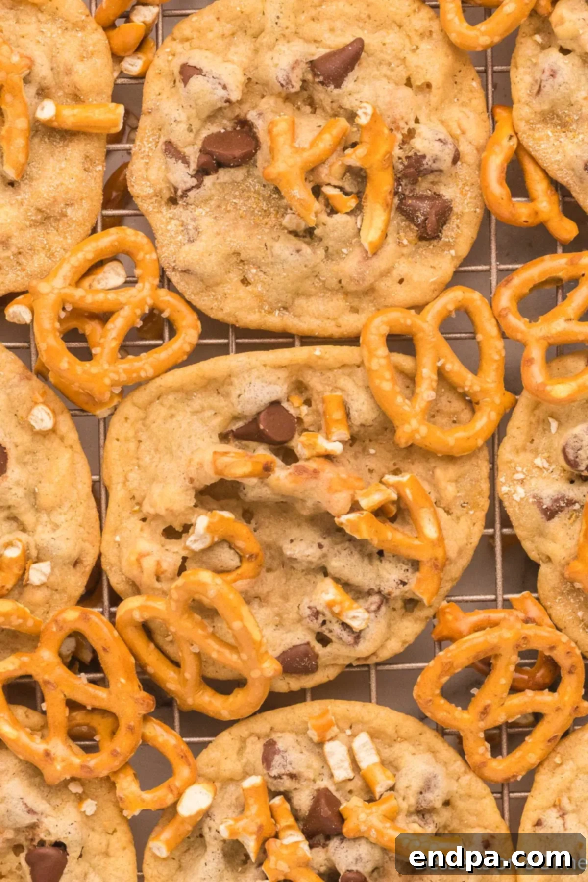 A batch of Chocolate Chip Pretzel Cookies arranged neatly on a cooling rack, showcasing their appealing texture.