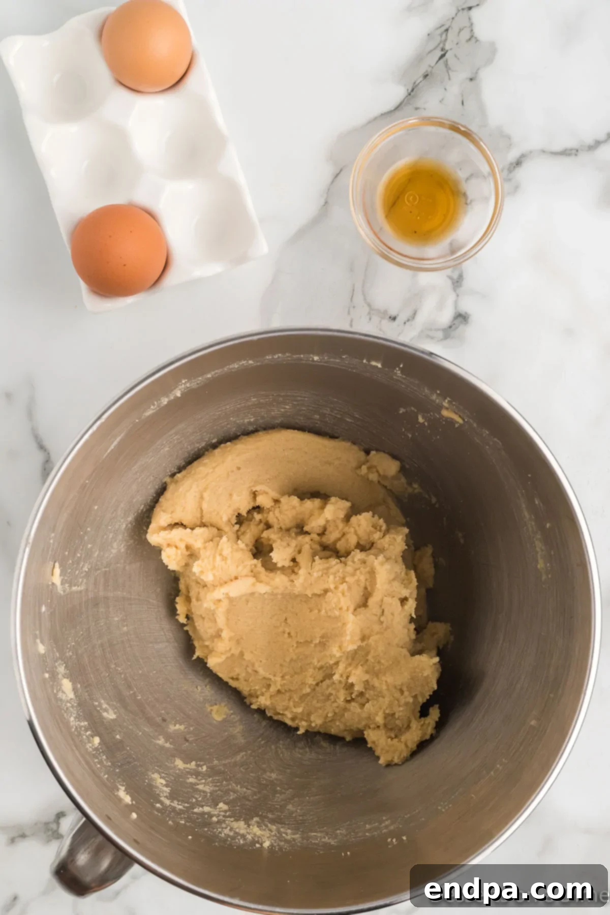 Creamed butter and sugar mixture, showing a light and fluffy texture.