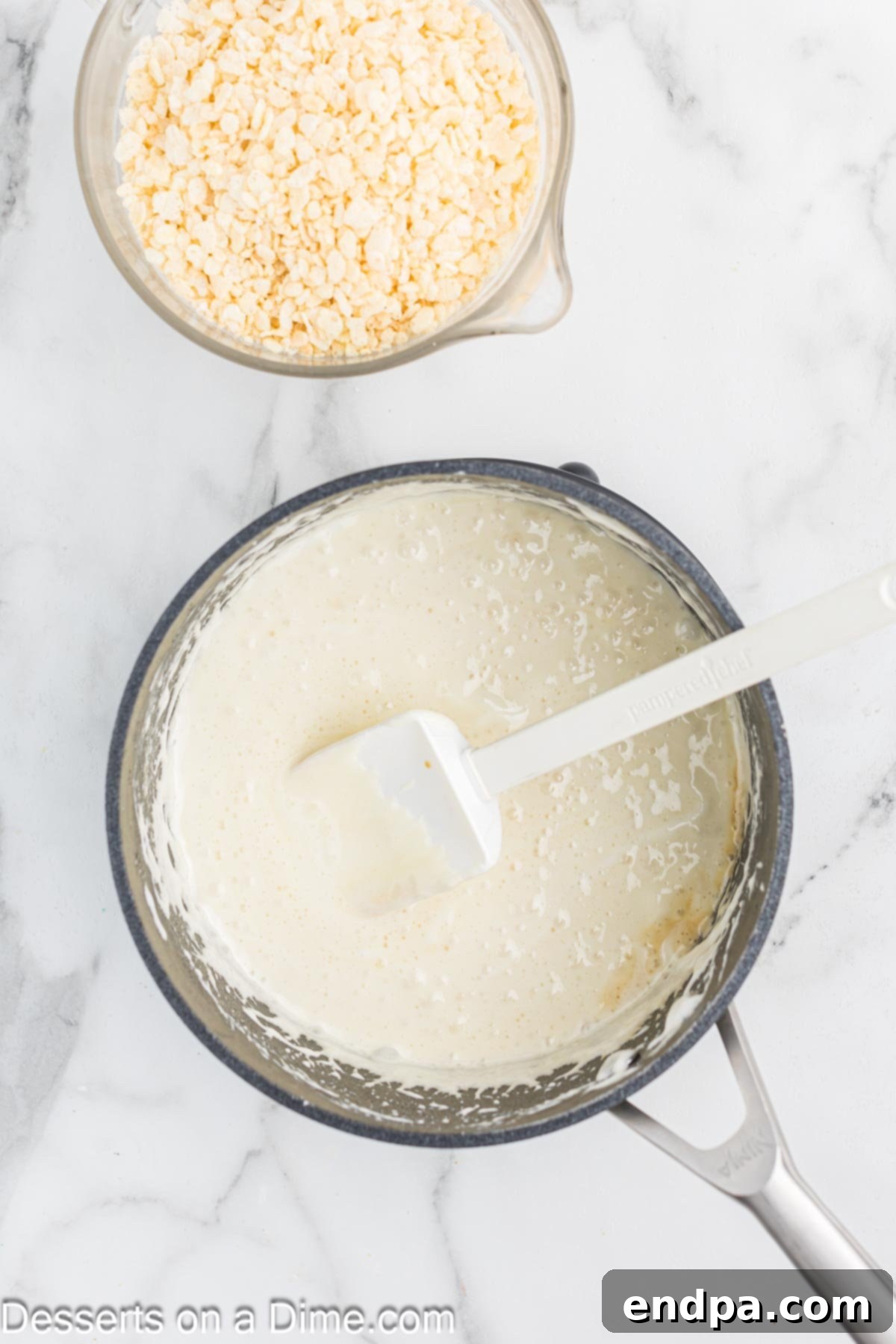 Melted marshmallows being stirred in a saucepan, ready for the cereal.