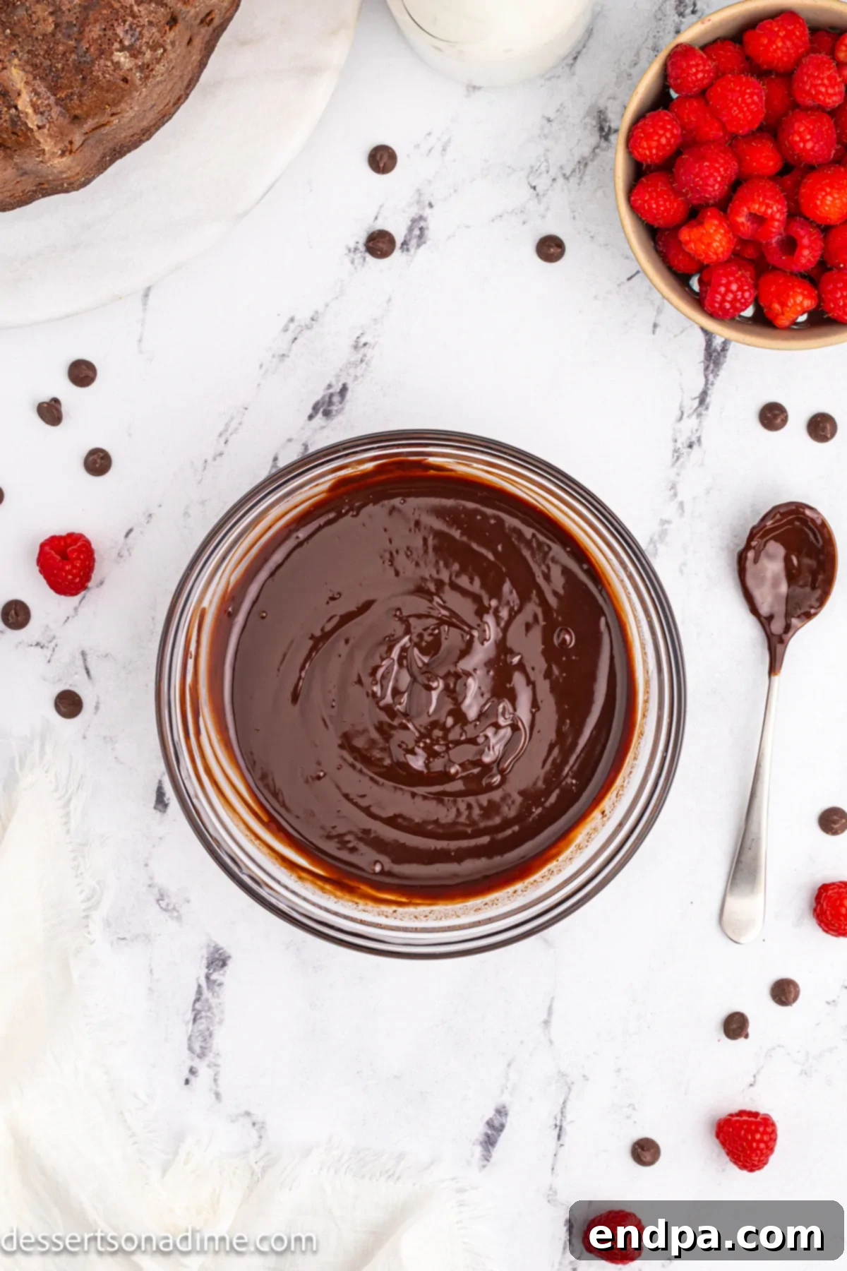 Smooth and combined chocolate ganache mixture in a bowl after whisking.
