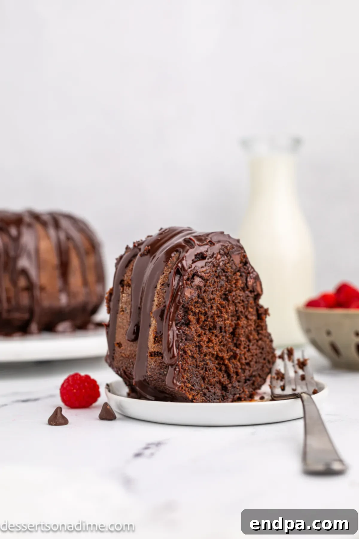 A perfectly sliced piece of Chocolate Brownie Cake, ready to be enjoyed on a plate.