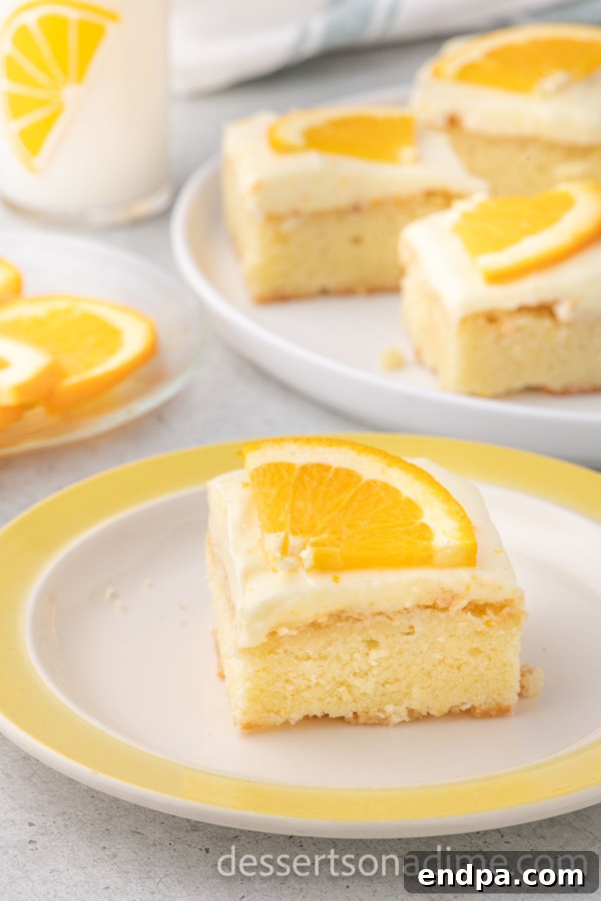 Orange Burst Brownies 2 Slice of Orange Brownie on a plate topped with orange slices