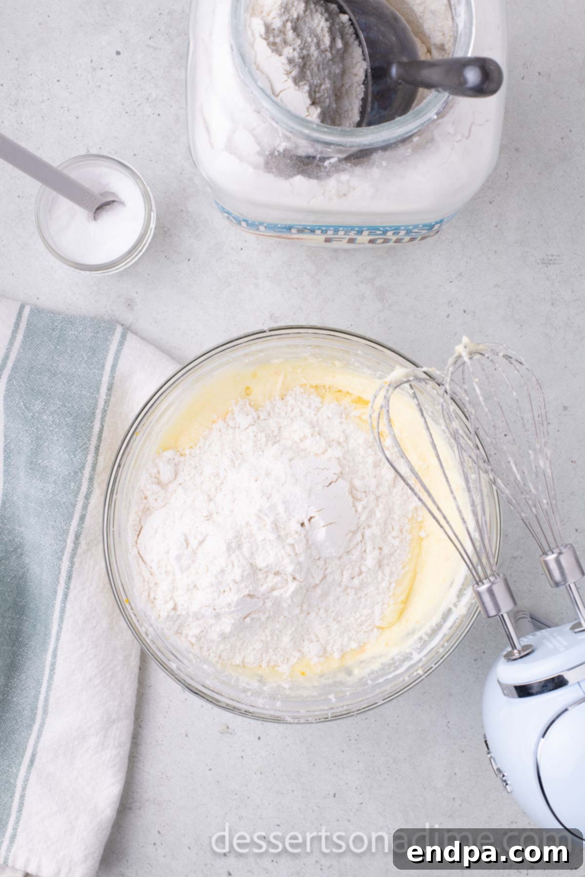 Orange Burst Brownies 6 Powdered sugar mixed into bowl.