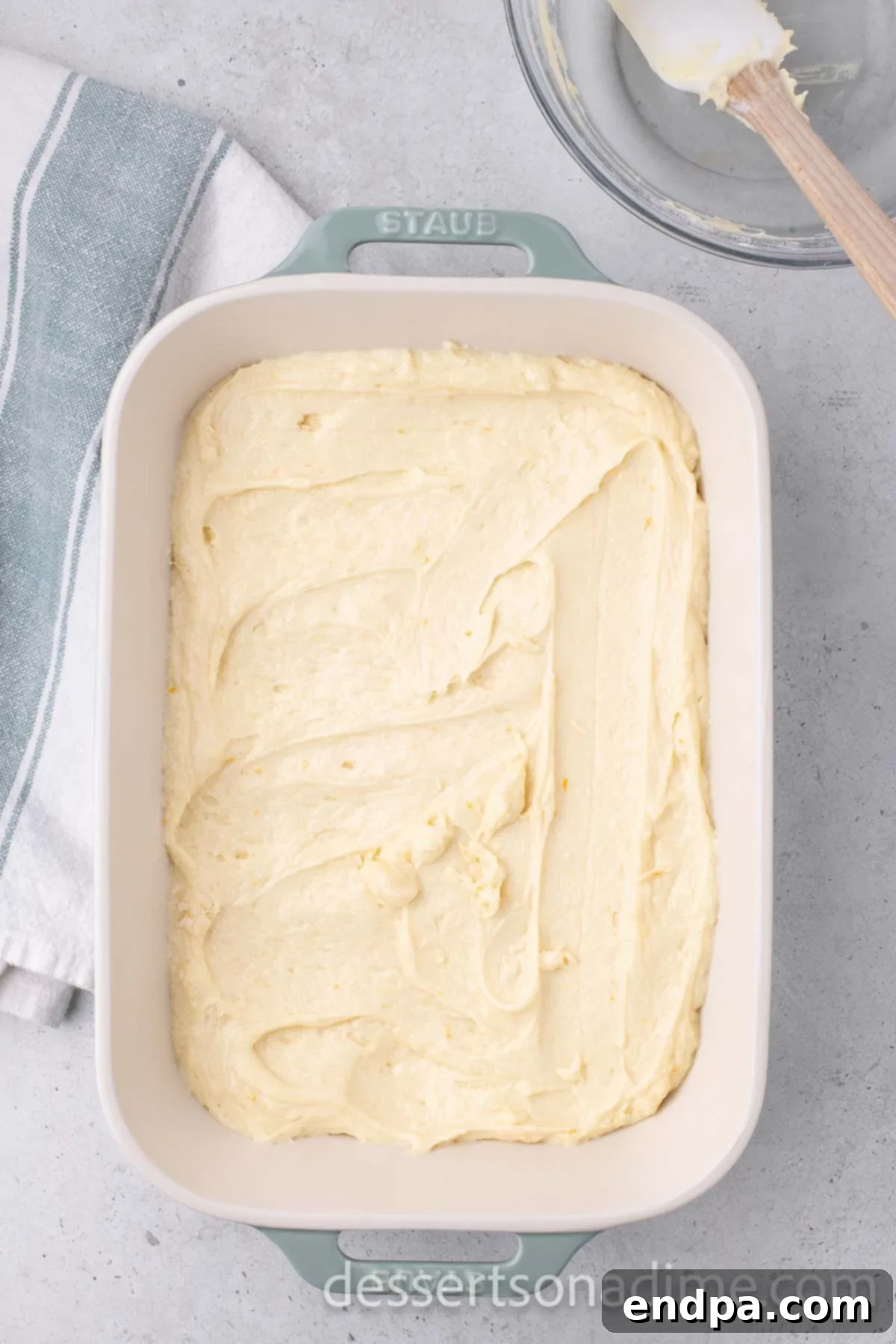 Orange Burst Brownies 8 Batter spread into baking dish.