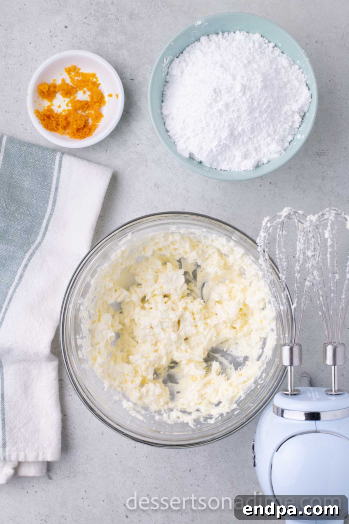 Orange Burst Brownies 9 Cream cheese and butter combined in a bowl.