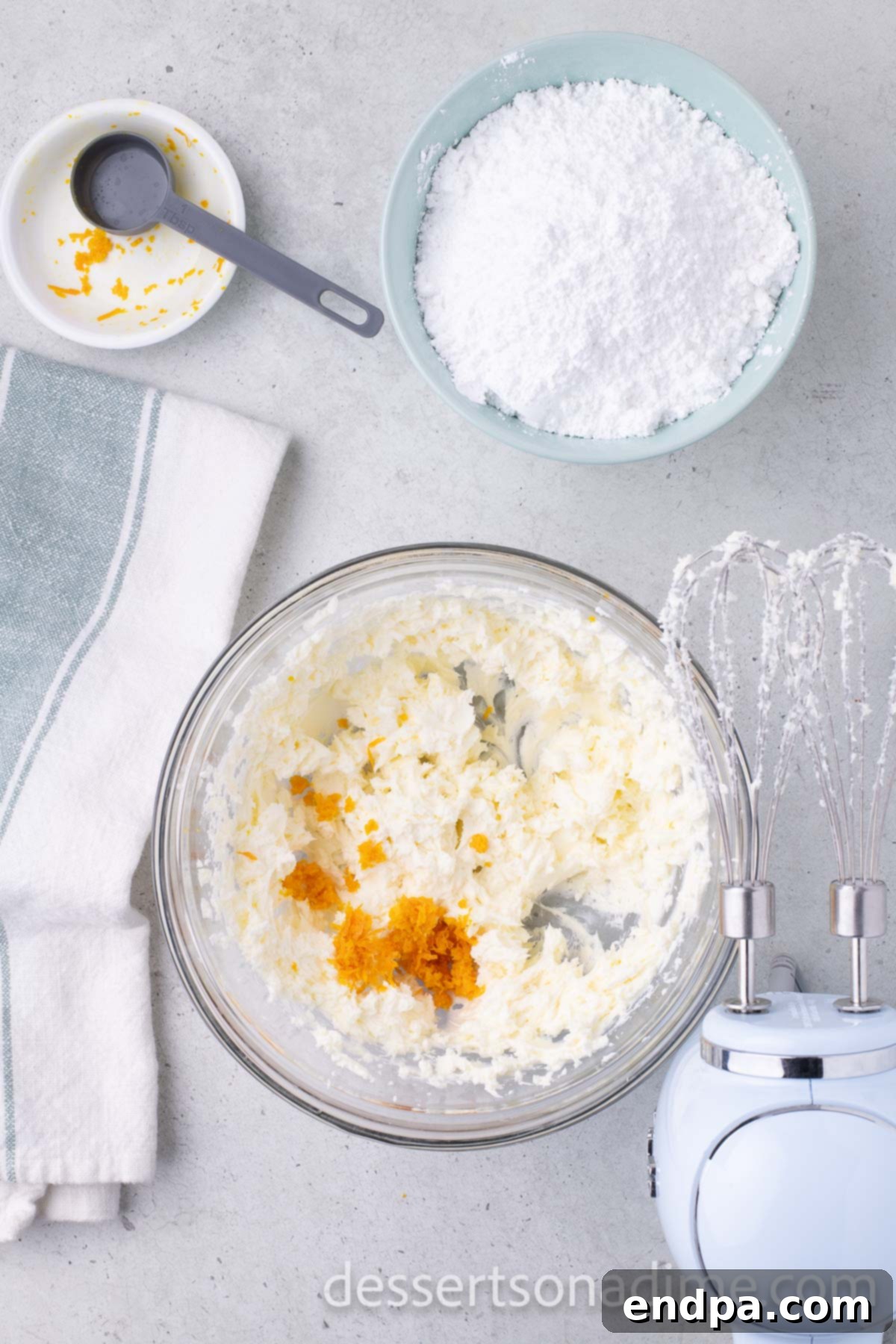 Orange Burst Brownies 10 Orange zest mixed into bowl.
