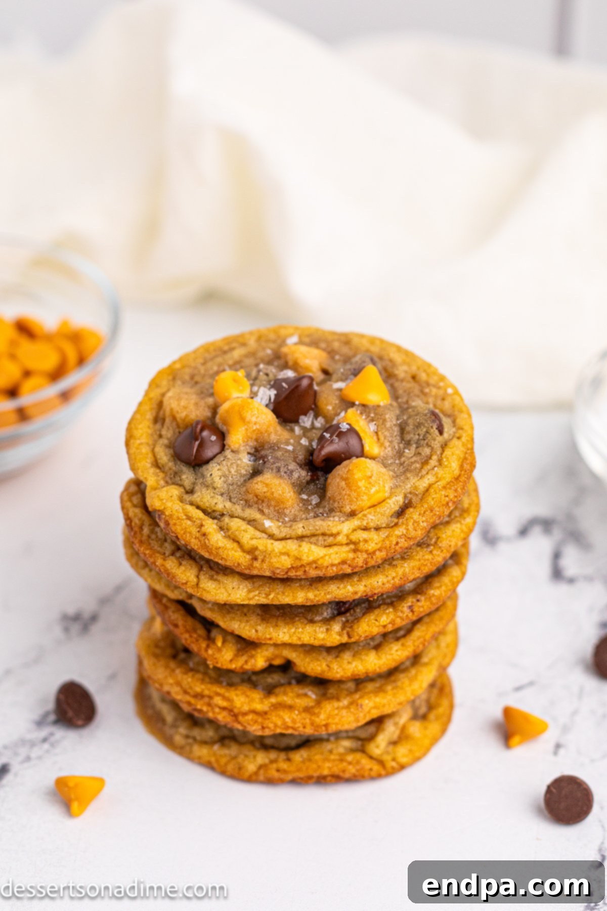 More freshly baked Butterscotch Chocolate Chip Cookies, stacked and ready to be enjoyed.
