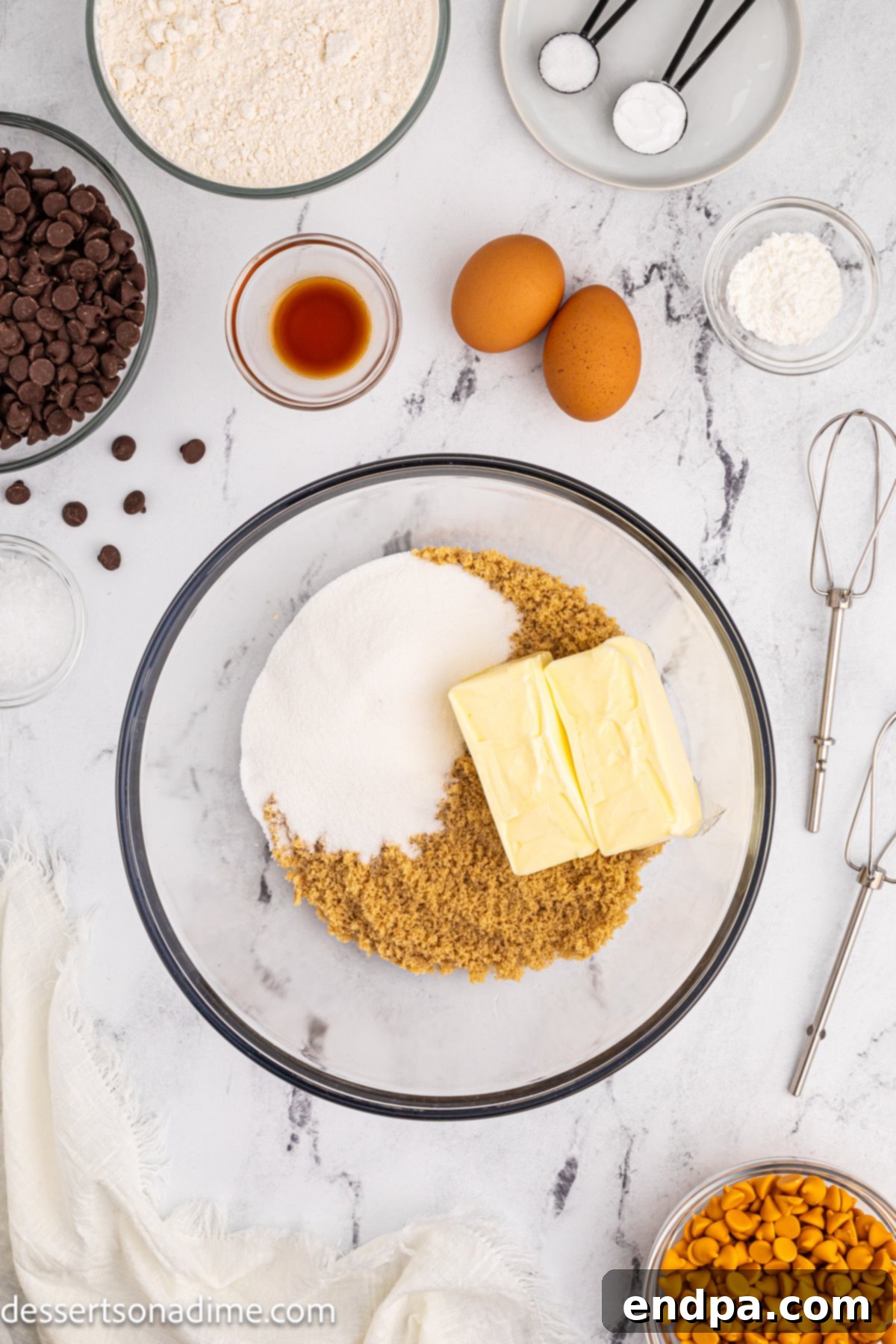 Mixing bowl with softened butter, light brown sugar, and granulated sugar.