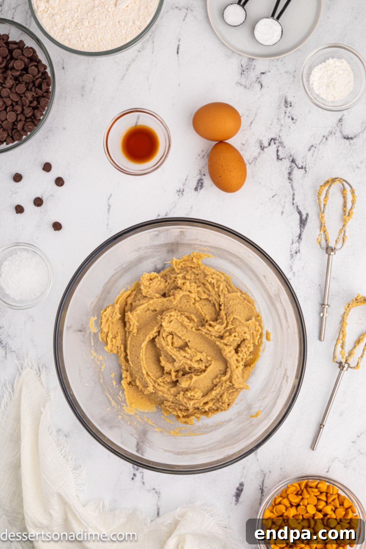 A creamy mixture of butter and sugars, thoroughly combined and light in color.