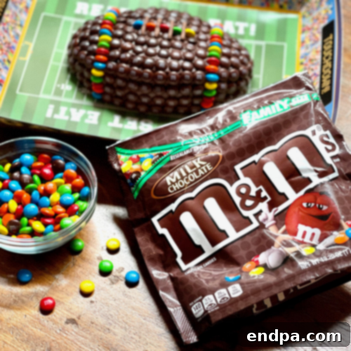 M&M Football Cake decorated with colorful candies.