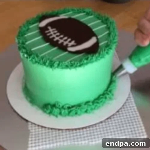 Simple Football Cake decorated with buttercream icing.