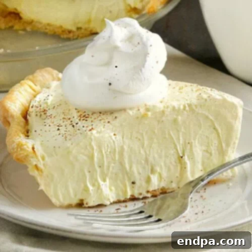 32 Christmas Pie Delights 13 A creamy, festive Eggnog Pie, a delightful holiday dessert.