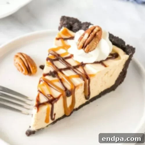 32 Christmas Pie Delights 18 A classic Turtle Pie with layers of caramel, chocolate, and pecans over an Oreo crust.